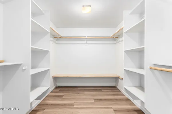 a view of an empty walk in closet