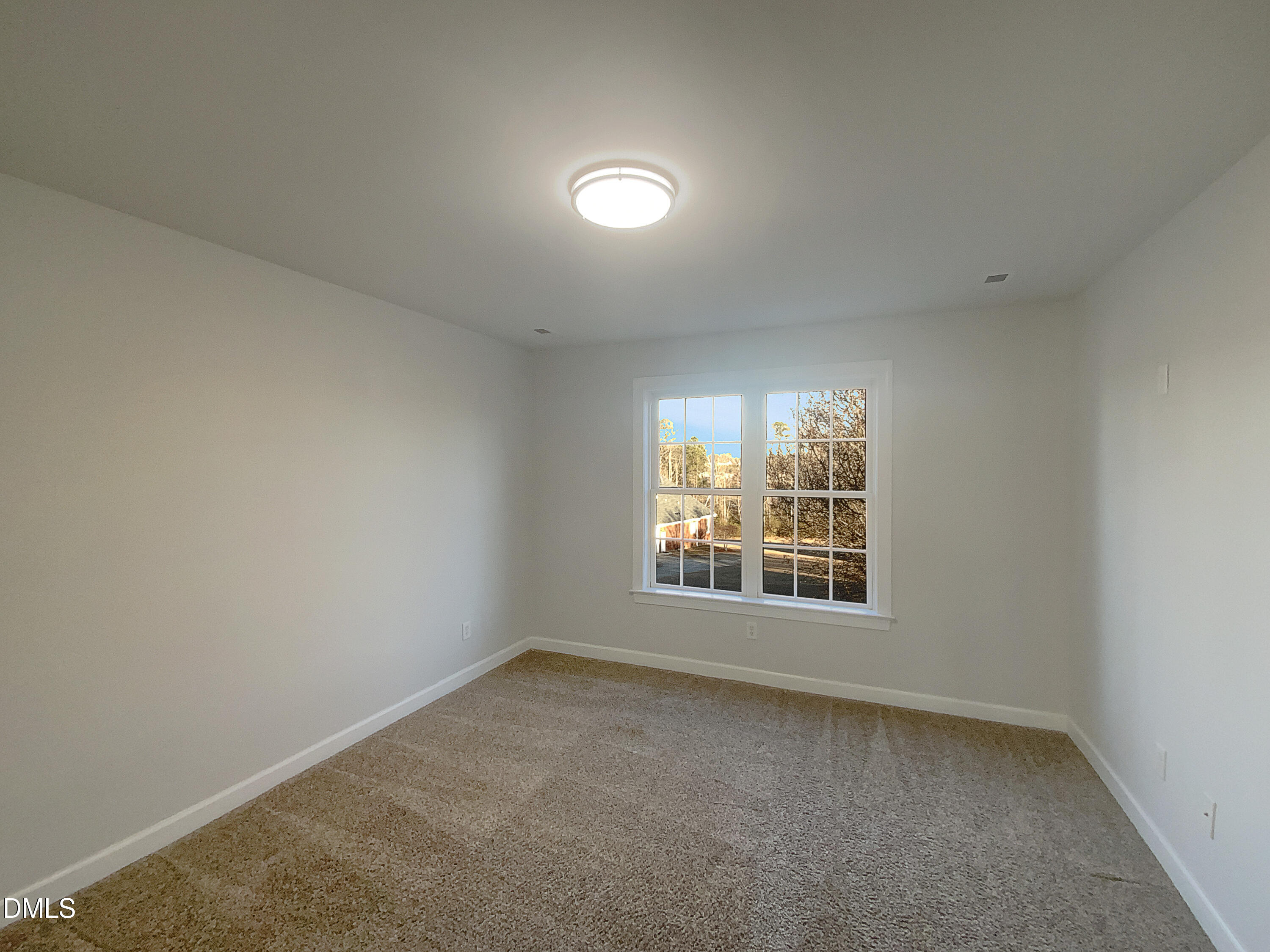 1217 Rolling Farm Drive Raleigh, NC 27603 - Photo 16 of 23 an empty room with a window