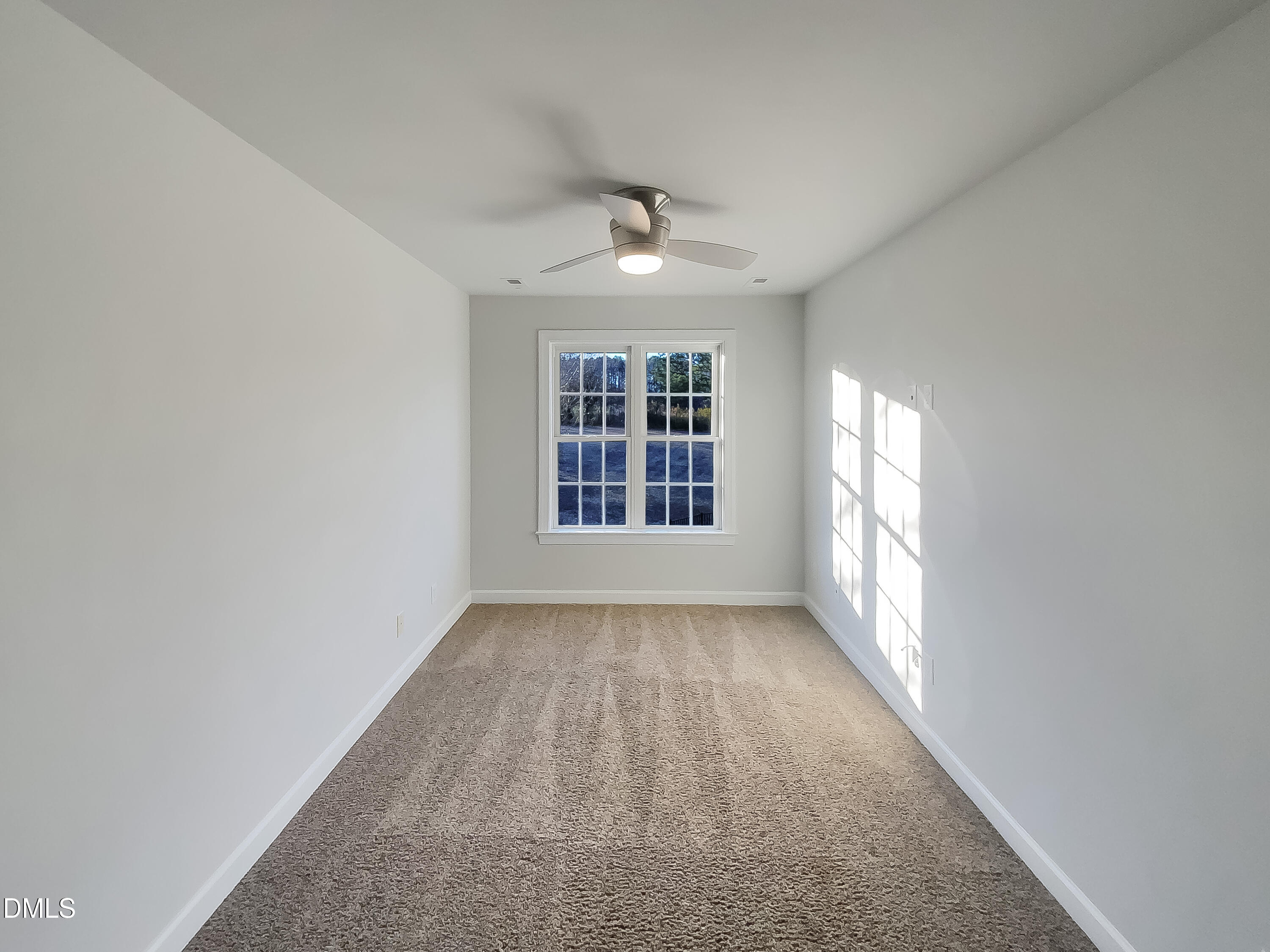 1217 Rolling Farm Drive Raleigh, NC 27603 - Photo 17 of 23 wooden floor in an empty room with a window