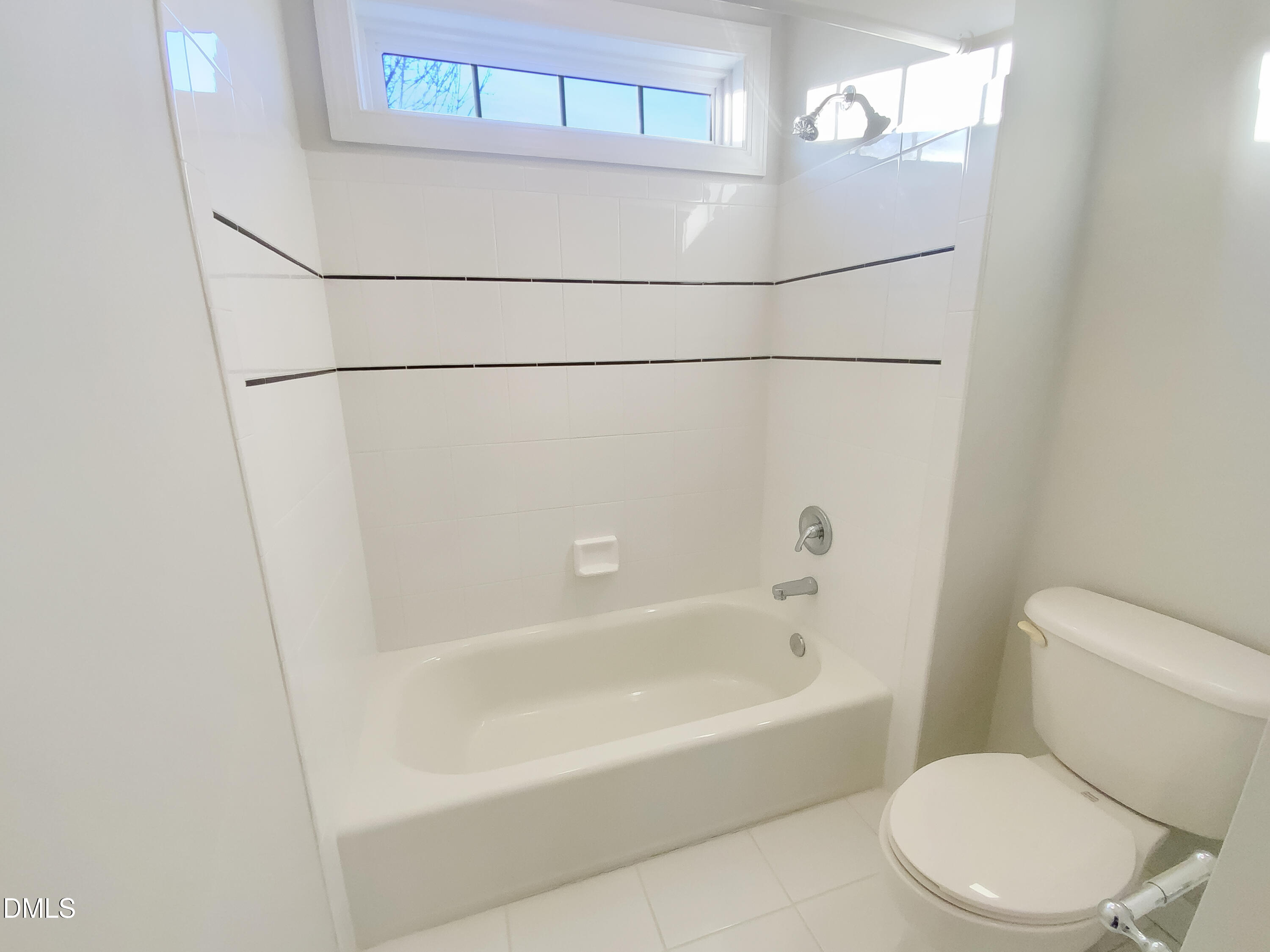 1217 Rolling Farm Drive Raleigh, NC 27603 - Photo 20 of 23 a white toilet sitting next to a bath tub