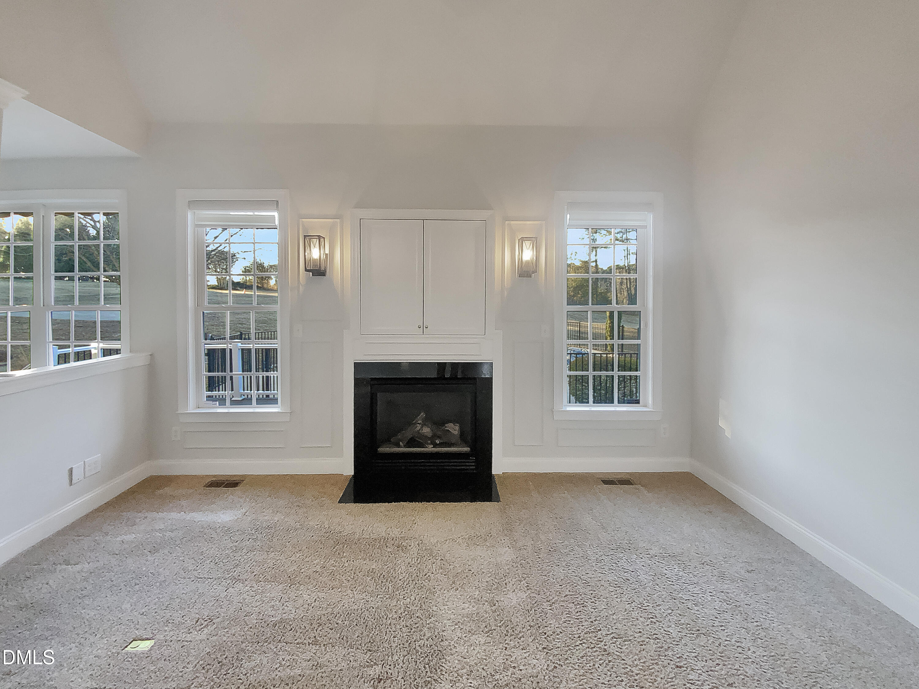1217 Rolling Farm Drive Raleigh, NC 27603 - Photo 3 of 23 an empty room with a fireplace and window