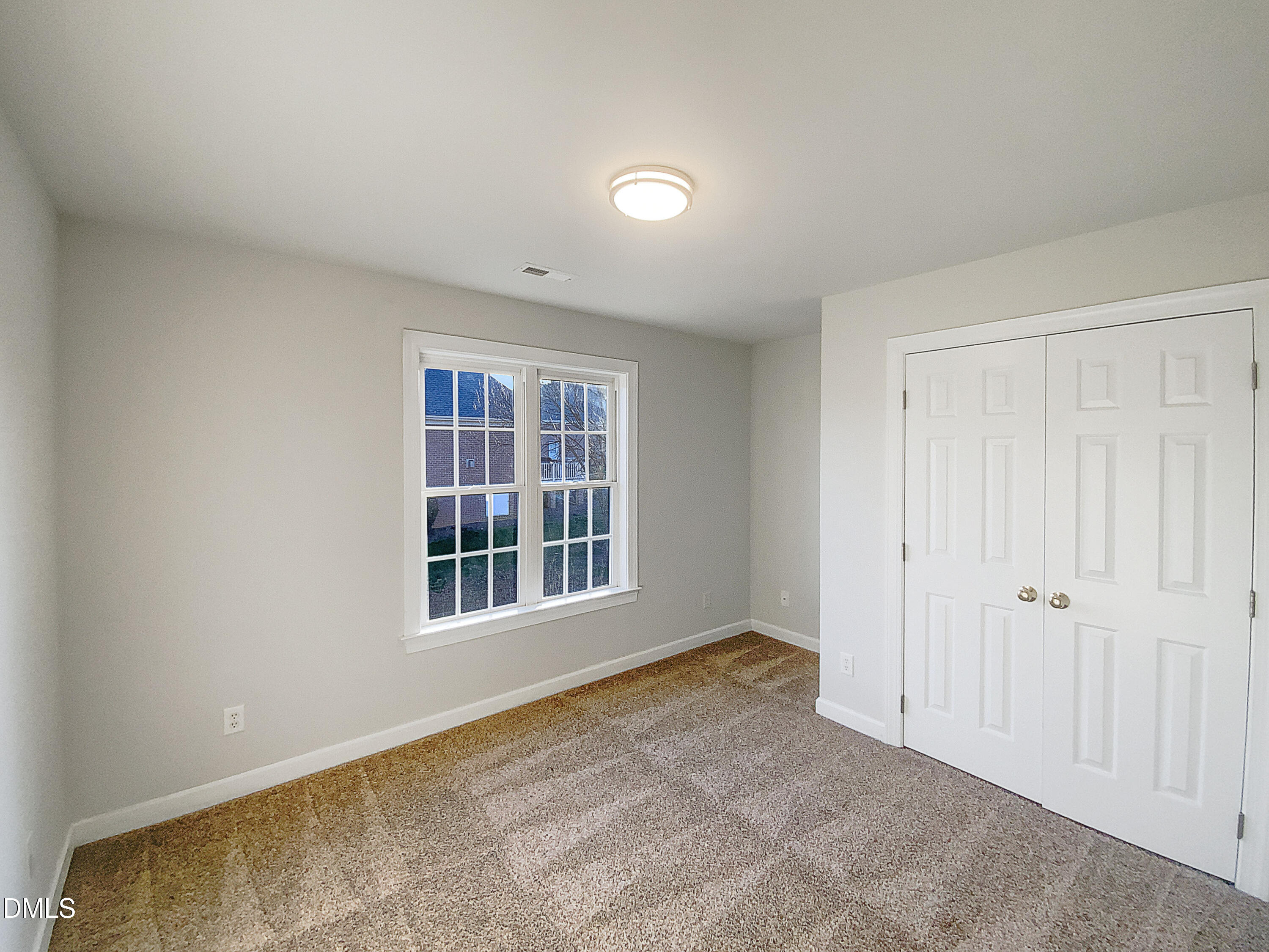 1217 Rolling Farm Drive Raleigh, NC 27603 - Photo 4 of 23 a view of an empty room with a window
