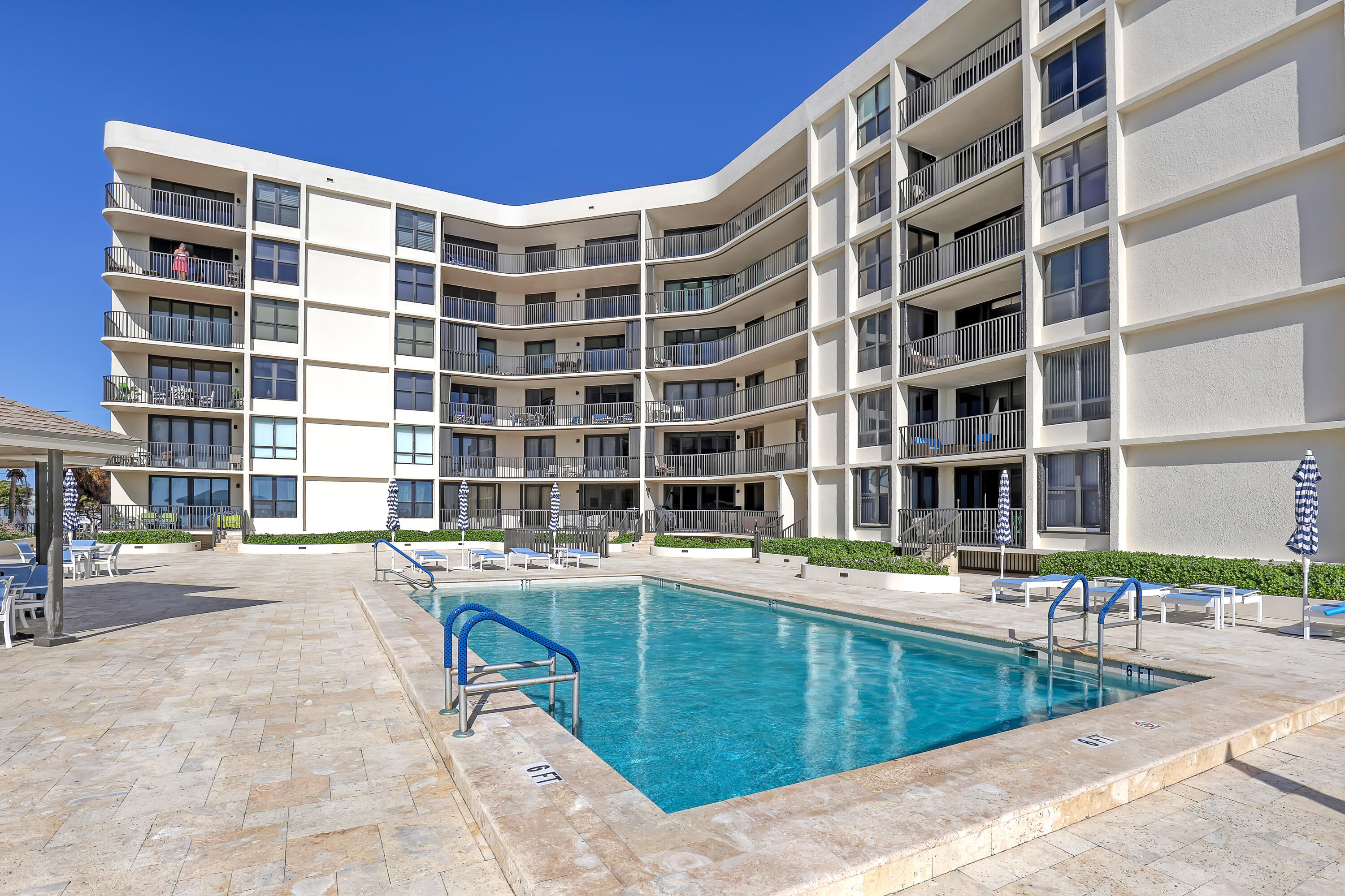3610 South Ocean Boulevard, Unit 508 South Palm Beach, FL 33480 - Photo 12 of 65 a dinning table and a chair in front of a building