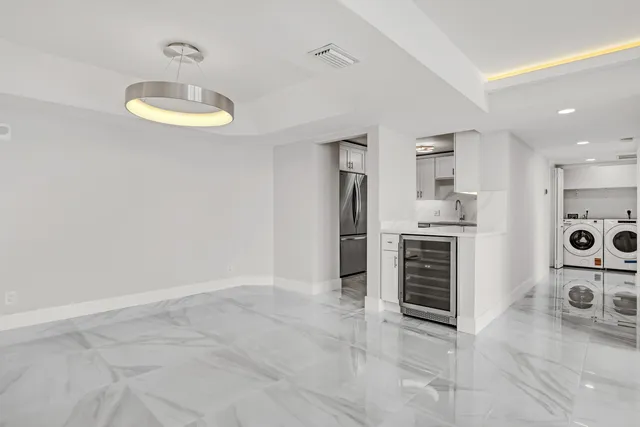 a kitchen with cabinets and steel stainless steel appliances