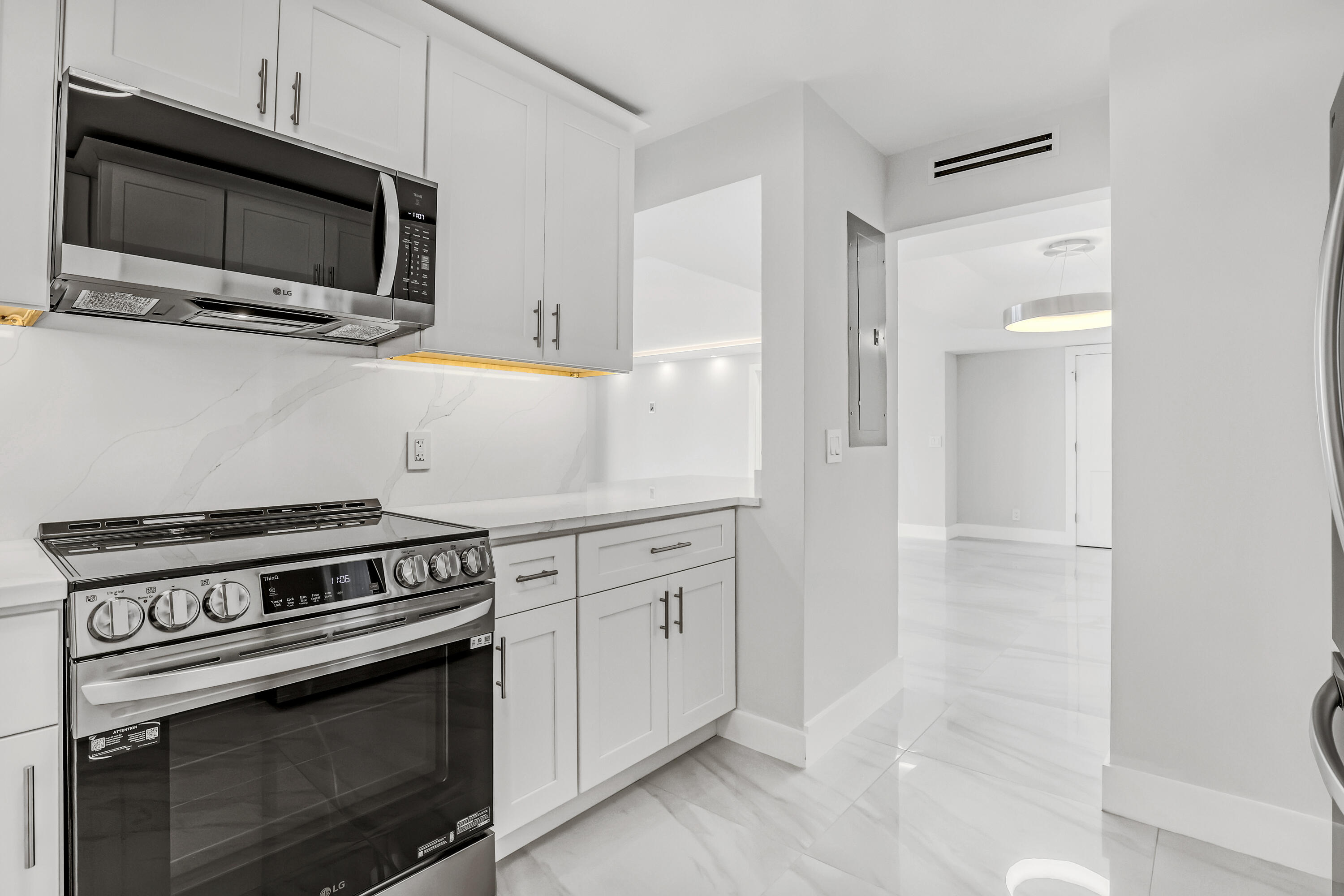 3610 South Ocean Boulevard, Unit 508 South Palm Beach, FL 33480 - Photo 32 of 65 a kitchen with cabinets and steel stainless steel appliances