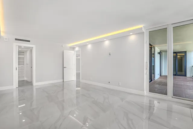 a bathroom with a walk in closet