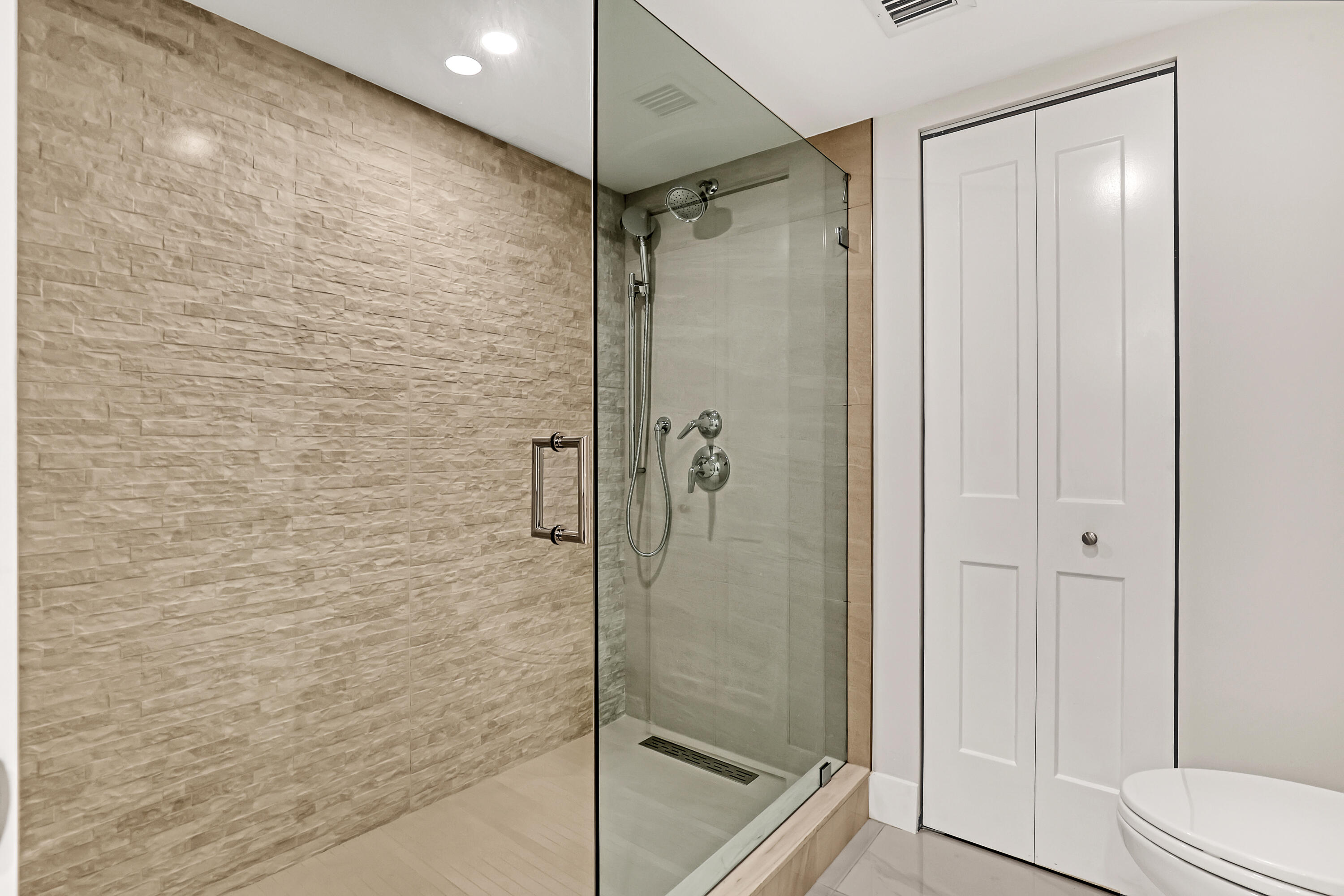 3610 South Ocean Boulevard, Unit 508 South Palm Beach, FL 33480 - Photo 41 of 65 a bathroom with a shower and a toilet