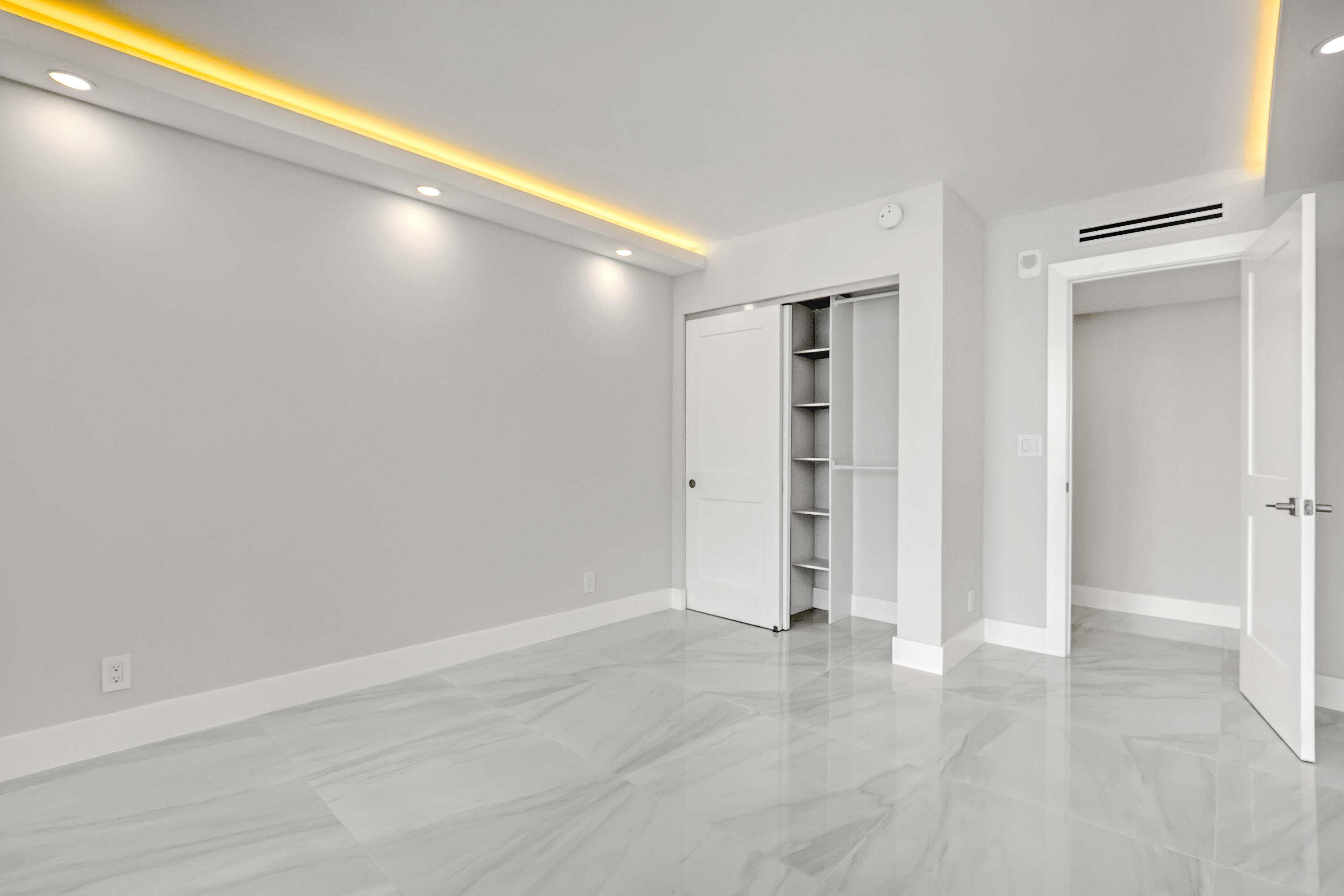 3610 South Ocean Boulevard, Unit 508 South Palm Beach, FL 33480 - Photo 47 of 65 an empty room with closet and wooden floor