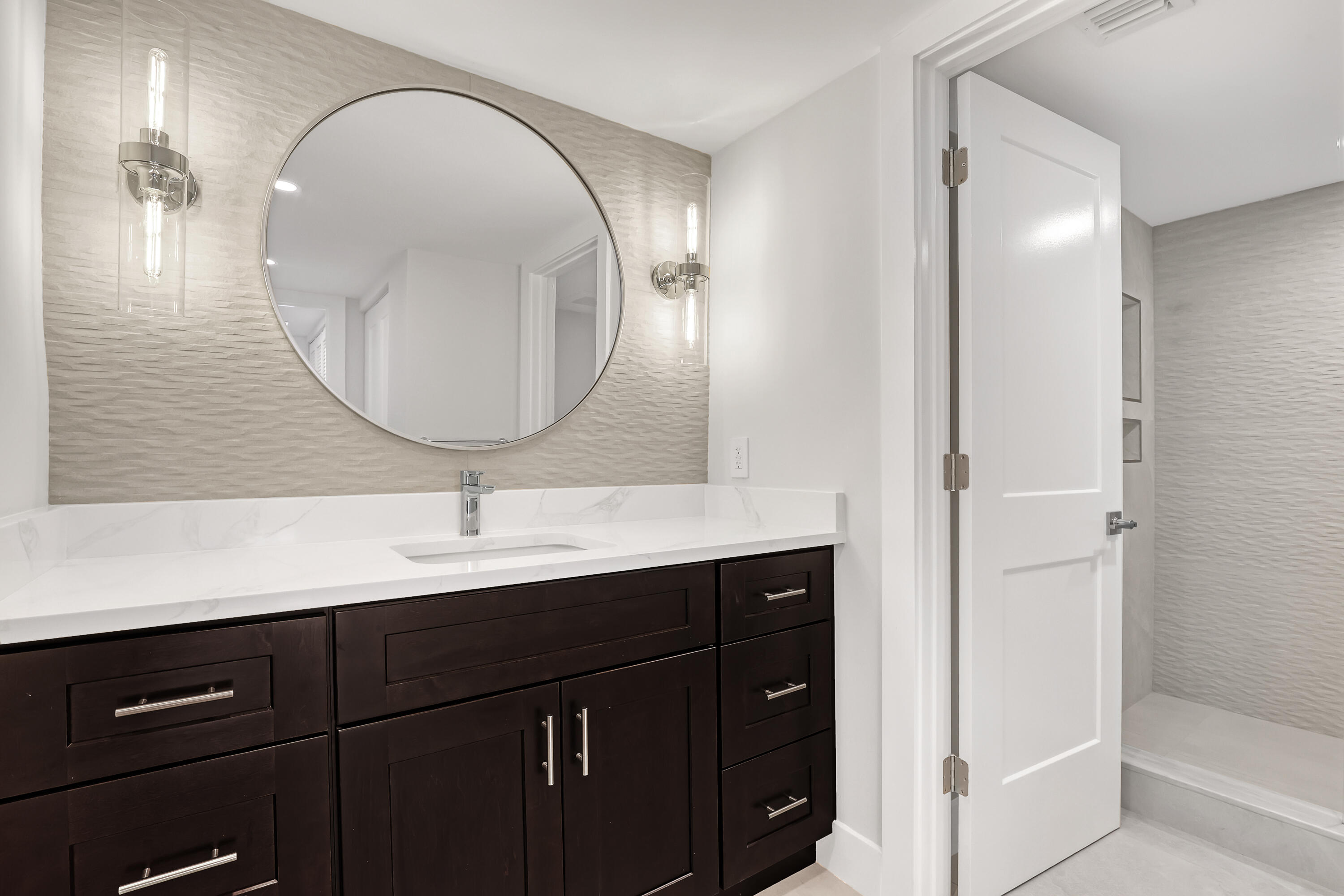 3610 South Ocean Boulevard, Unit 508 South Palm Beach, FL 33480 - Photo 49 of 65 a bathroom with a sink and a mirror