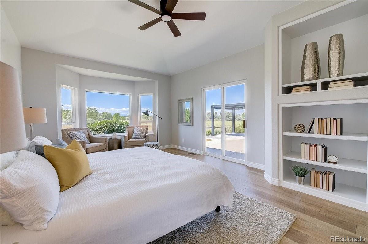 6063 South Eagle Street Centennial, CO 80016 - Photo 22 of 40 a spacious bedroom with a large bed and a window
