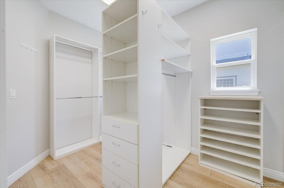 6063 South Eagle Street Centennial, CO 80016 - Photo 28 of 40 a view of walk in closet with empty racks