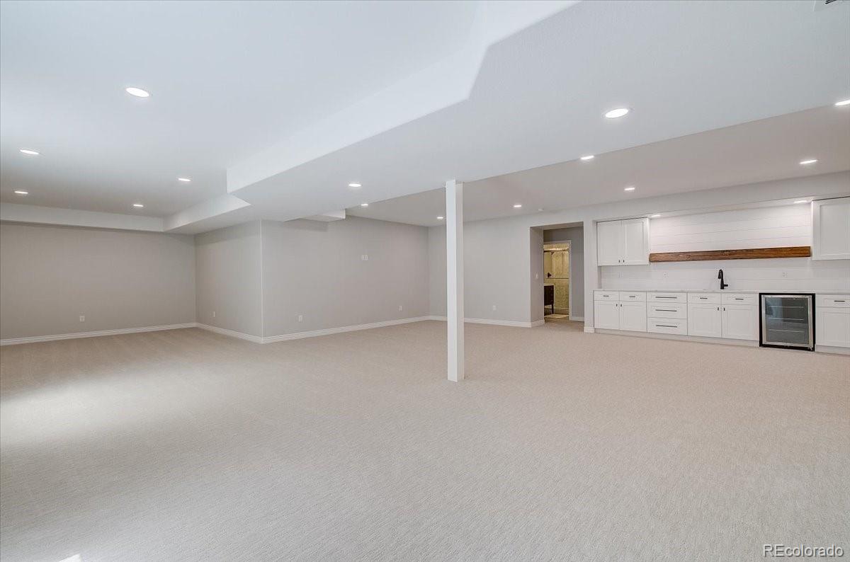 6063 South Eagle Street Centennial, CO 80016 - Photo 33 of 40 a view of an empty room with a kitchen