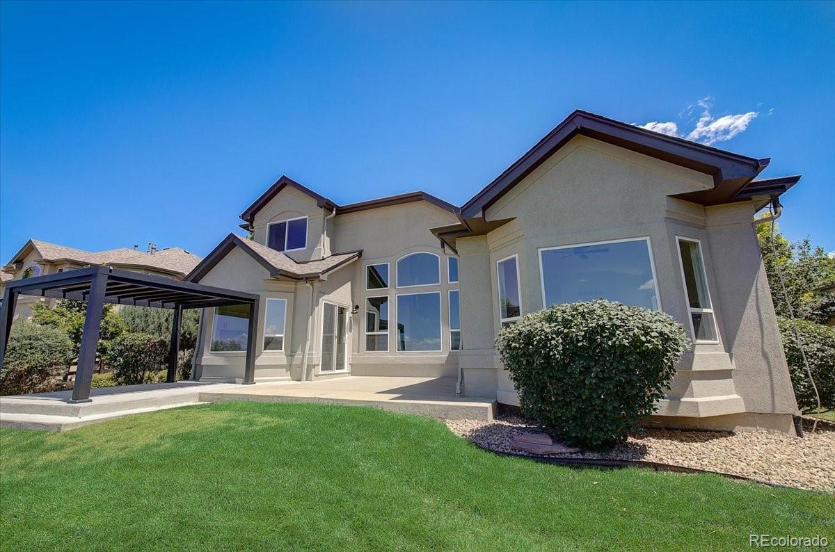 6063 South Eagle Street Centennial, CO 80016 - Photo 40 of 40 a front view of a house with a yard
