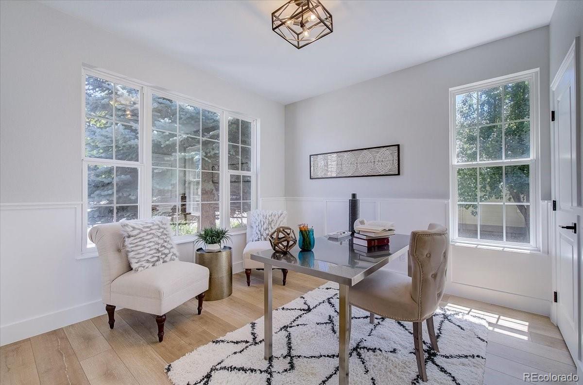 6063 South Eagle Street Centennial, CO 80016 - Photo 5 of 40 a living room with furniture and a large window