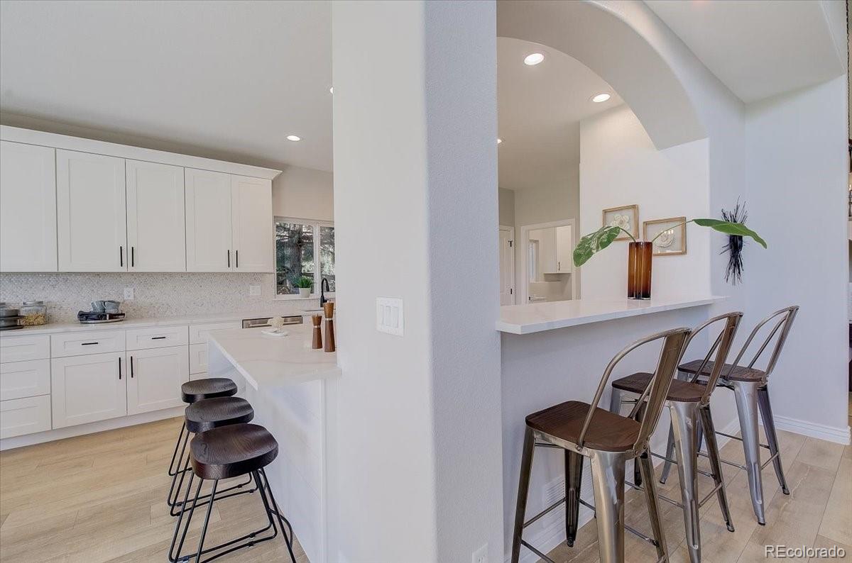 6063 South Eagle Street Centennial, CO 80016 - Photo 9 of 40 a kitchen with a table and chairs in it