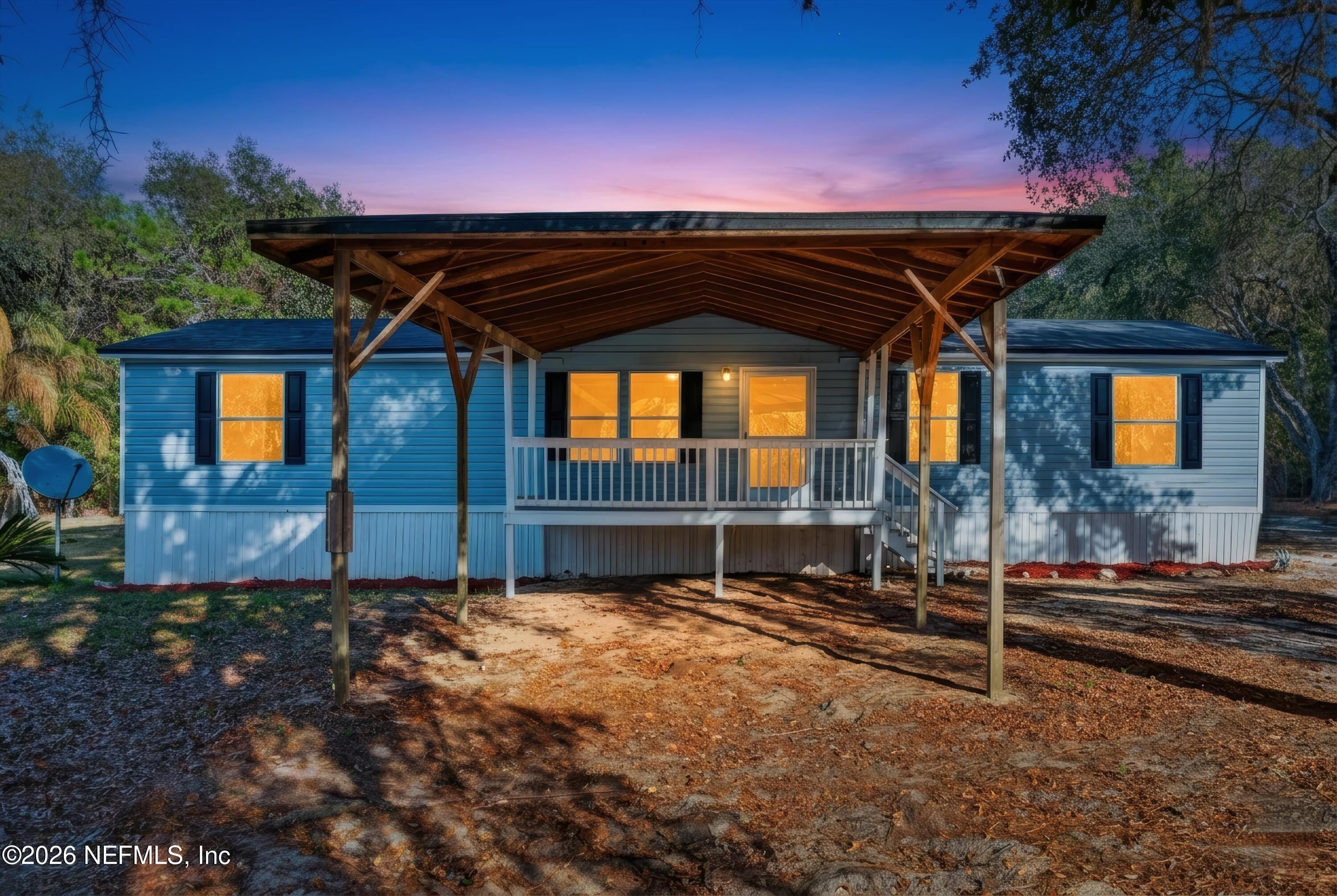 7595 Oak Forest Road Keystone Heights, FL 32656 - Photo 1 of 49 a front view of a house with a yard