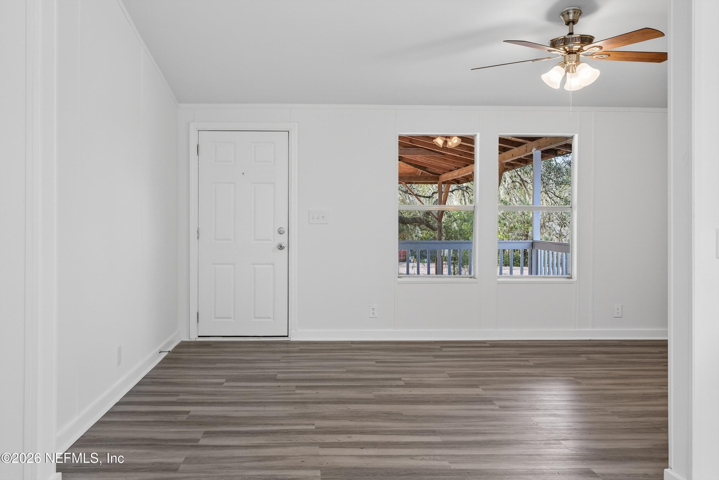 7595 Oak Forest Road Keystone Heights, FL 32656 - Photo 11 of 49 a view of room with window ceiling fan and hardwood floor