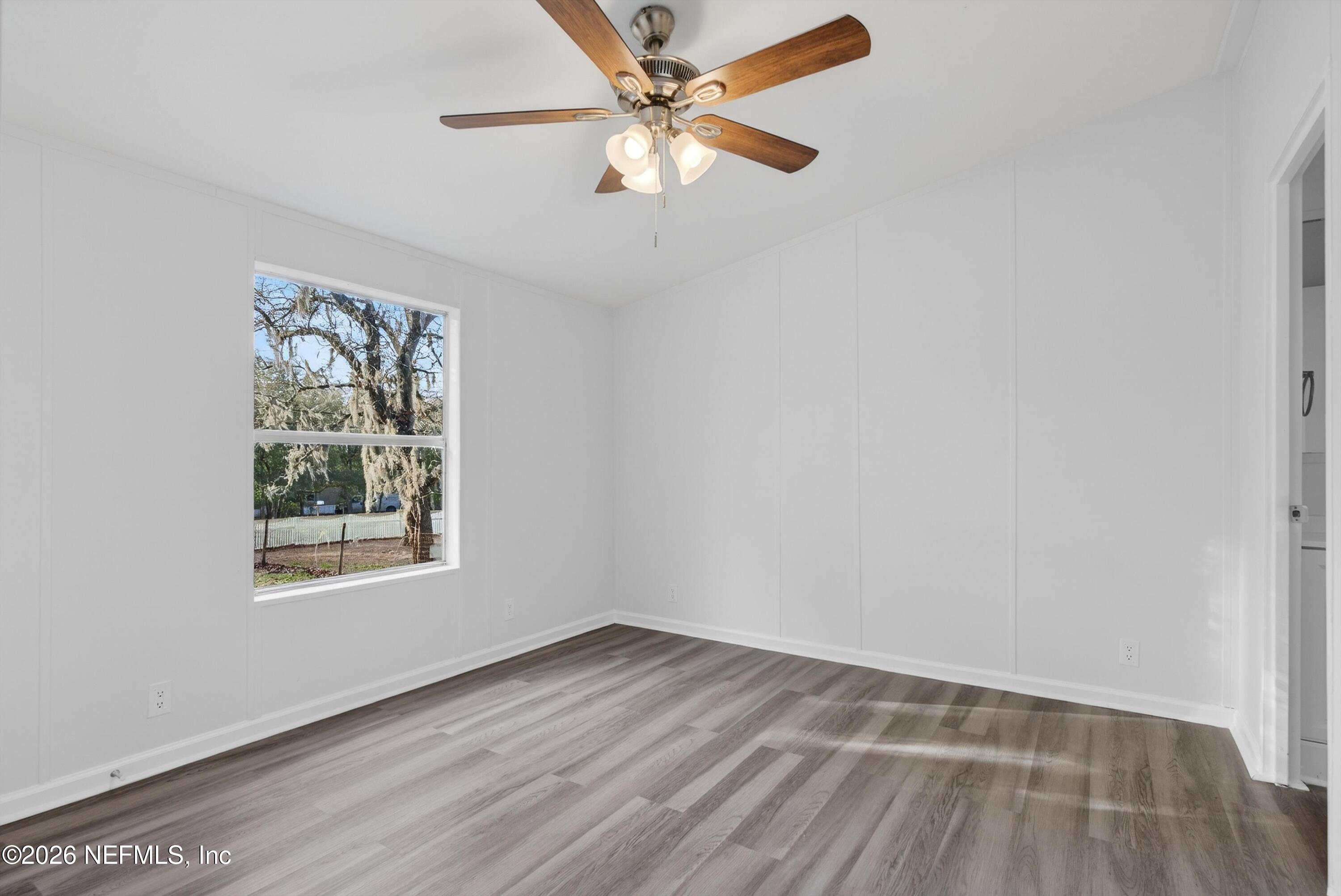 7595 Oak Forest Road Keystone Heights, FL 32656 - Photo 24 of 49 an empty room with a window and a fan