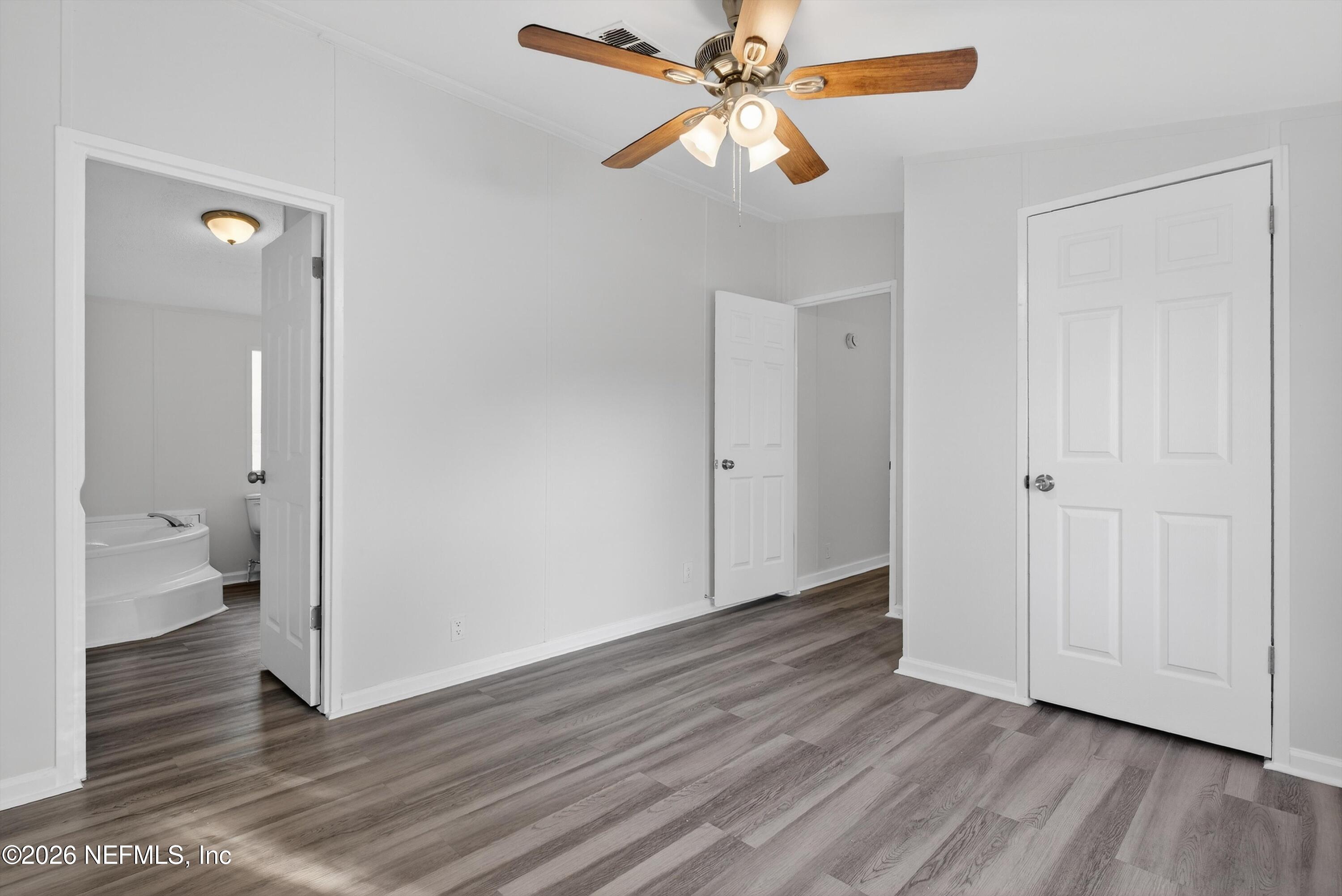 7595 Oak Forest Road Keystone Heights, FL 32656 - Photo 25 of 49 a view of an empty room and wooden floor