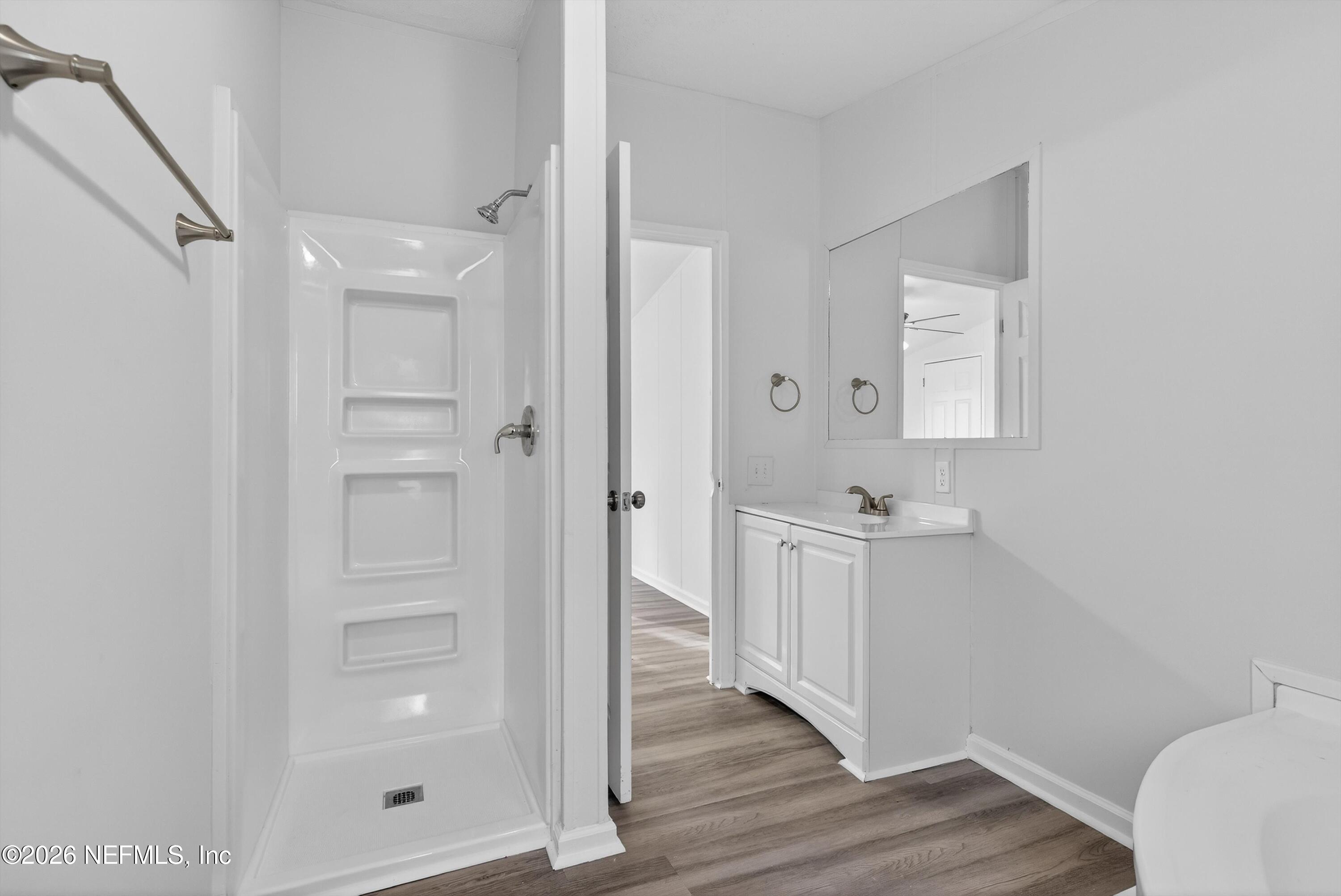7595 Oak Forest Road Keystone Heights, FL 32656 - Photo 27 of 49 a bathroom with a sink a toilet and shower