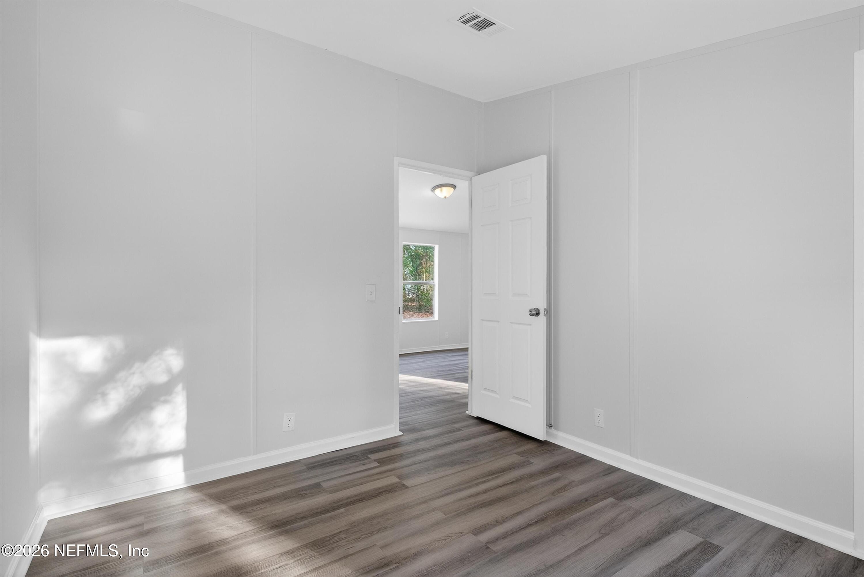 7595 Oak Forest Road Keystone Heights, FL 32656 - Photo 31 of 49 a view of empty room with wooden floor
