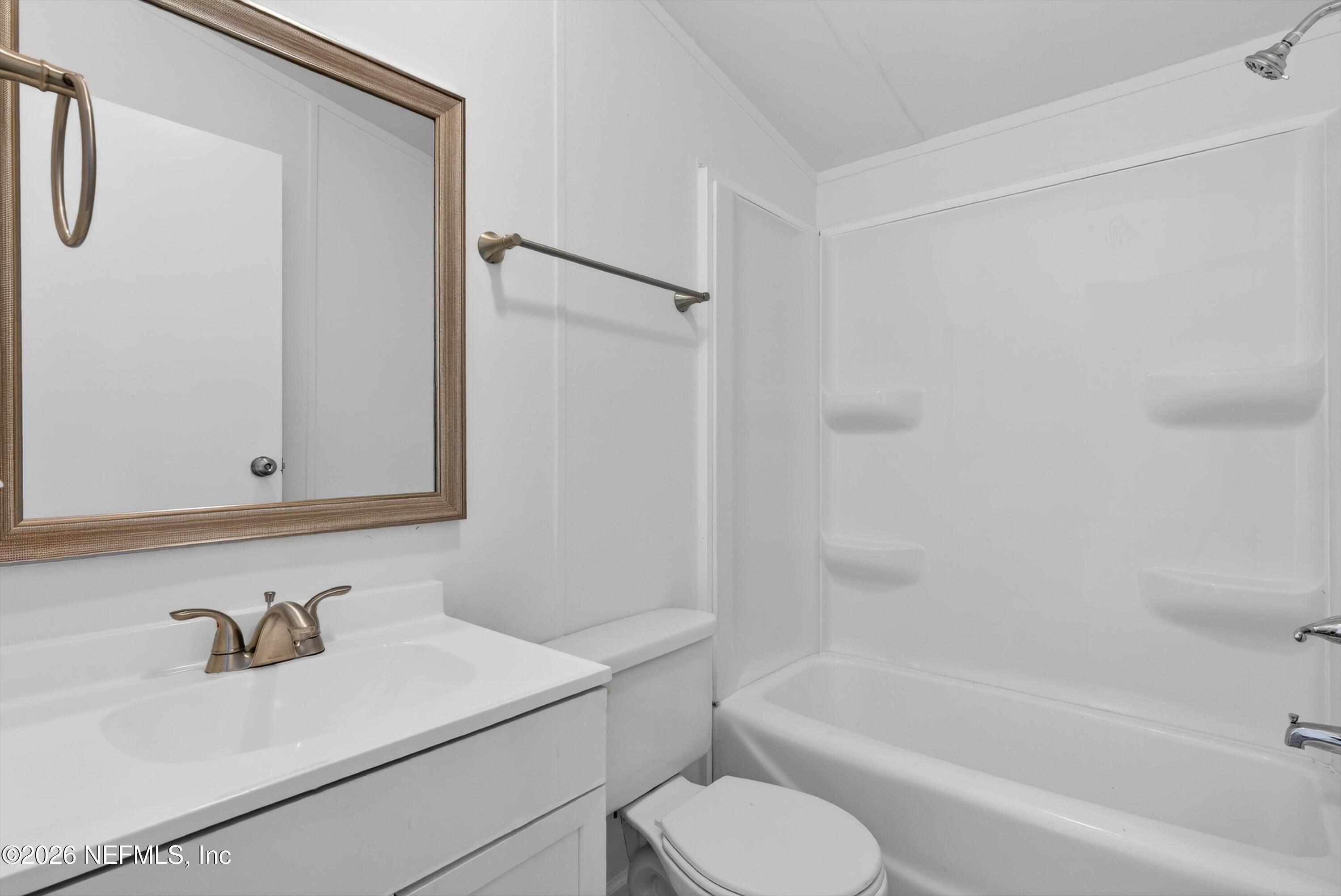 7595 Oak Forest Road Keystone Heights, FL 32656 - Photo 32 of 49 a bathroom with a sink toilet and bathtub