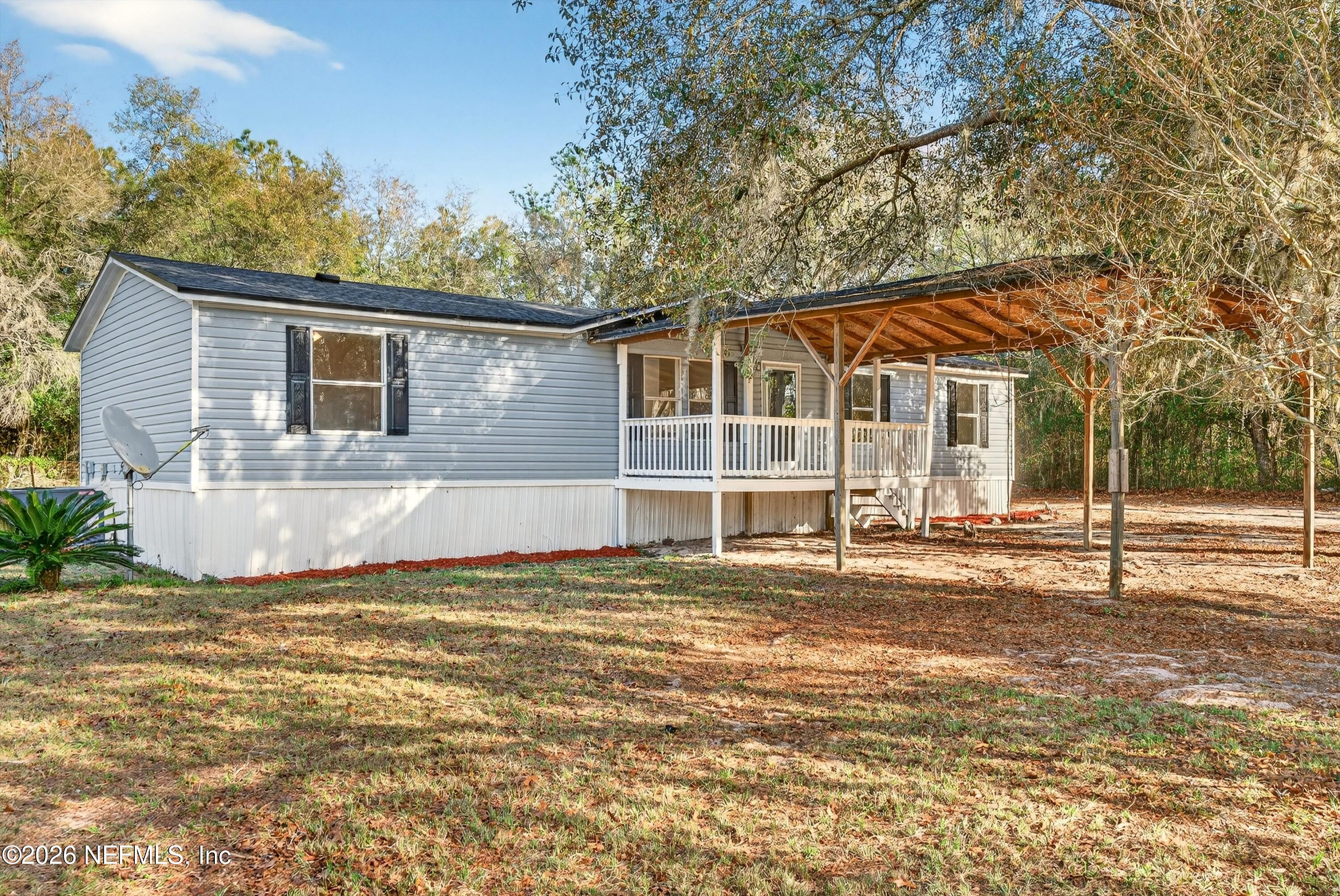 7595 Oak Forest Road Keystone Heights, FL 32656 - Photo 3 of 49 a view of a house with a yard