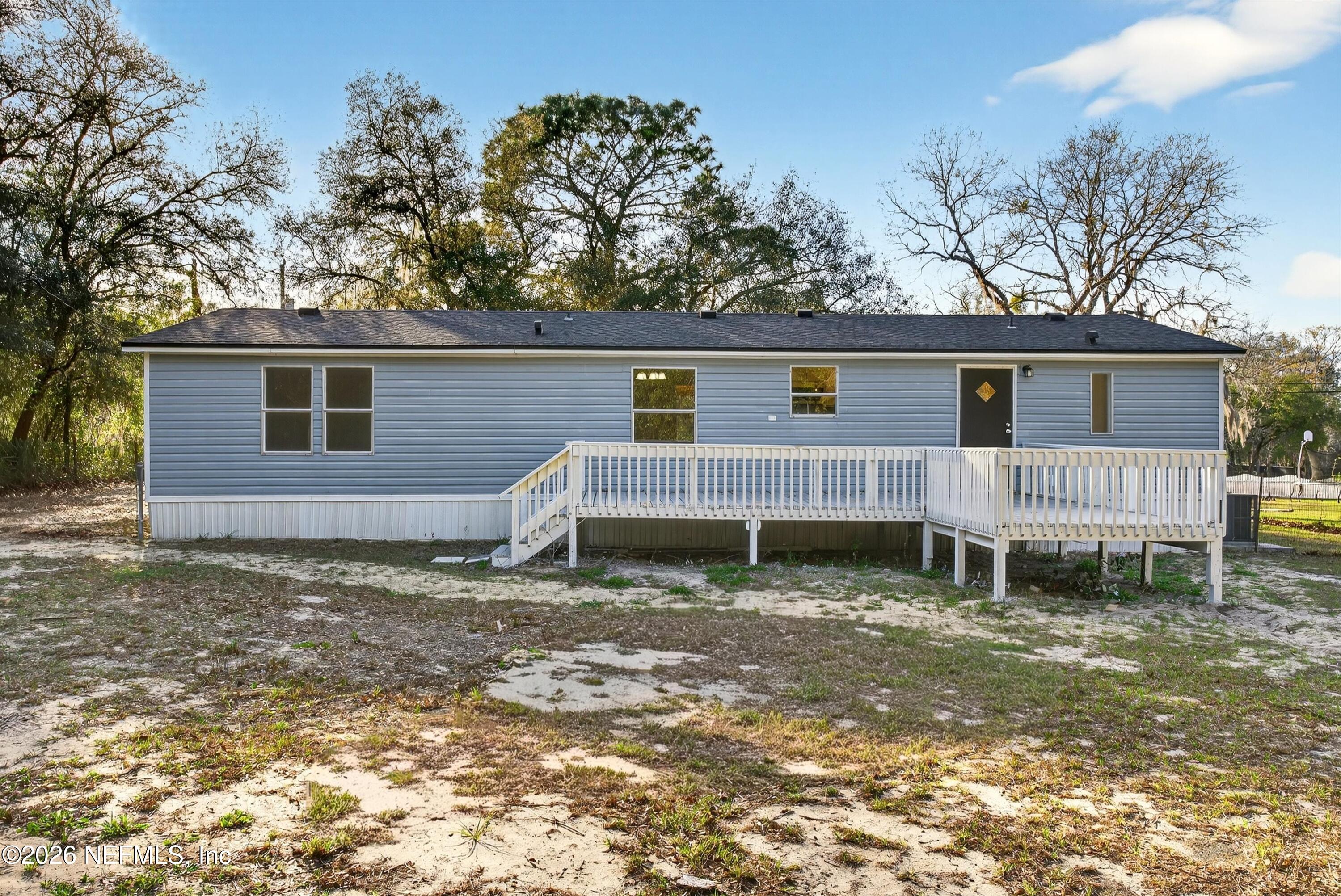 7595 Oak Forest Road Keystone Heights, FL 32656 - Photo 41 of 49 a backyard of a house with barbeque oven