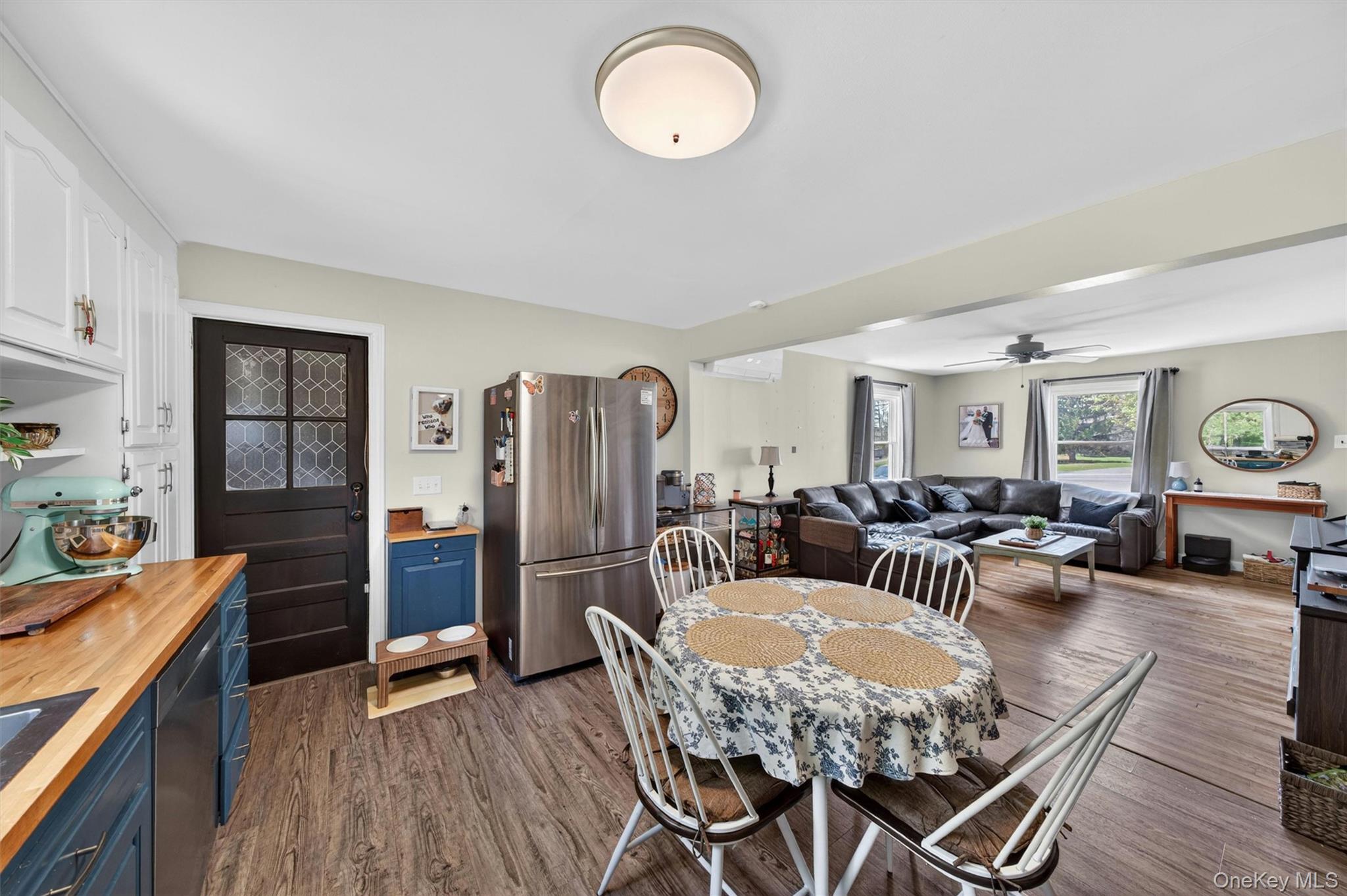 151 Laroe Road Chester, NY 10918 - Photo 20 of 43 a living room with furniture a lamp wooden floor and a large window