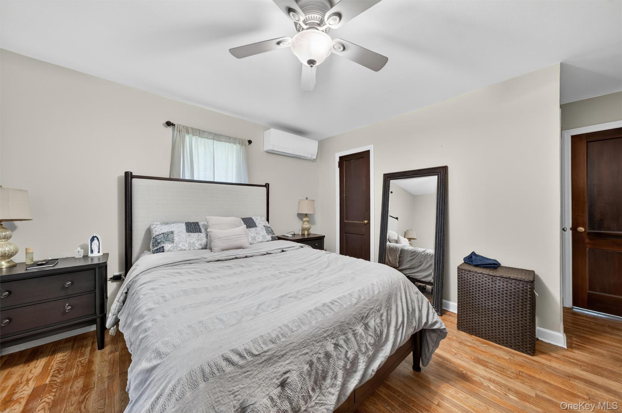 151 Laroe Road Chester, NY 10918 - Photo 23 of 43 a bedroom with a bed and a chandelier