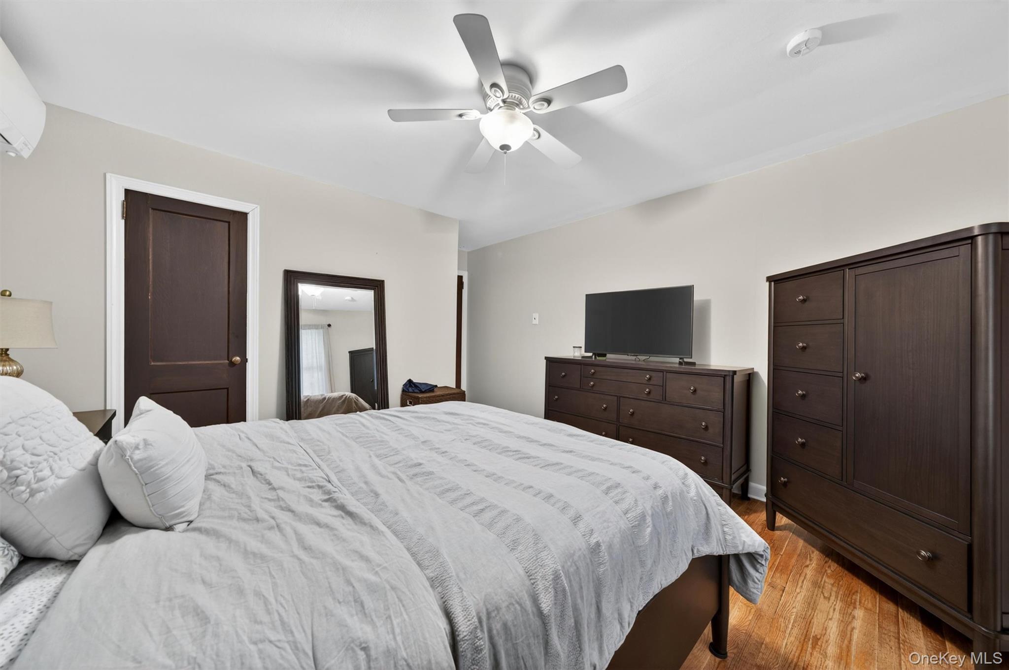 151 Laroe Road Chester, NY 10918 - Photo 24 of 43 a bedroom with a bed and a flat screen tv