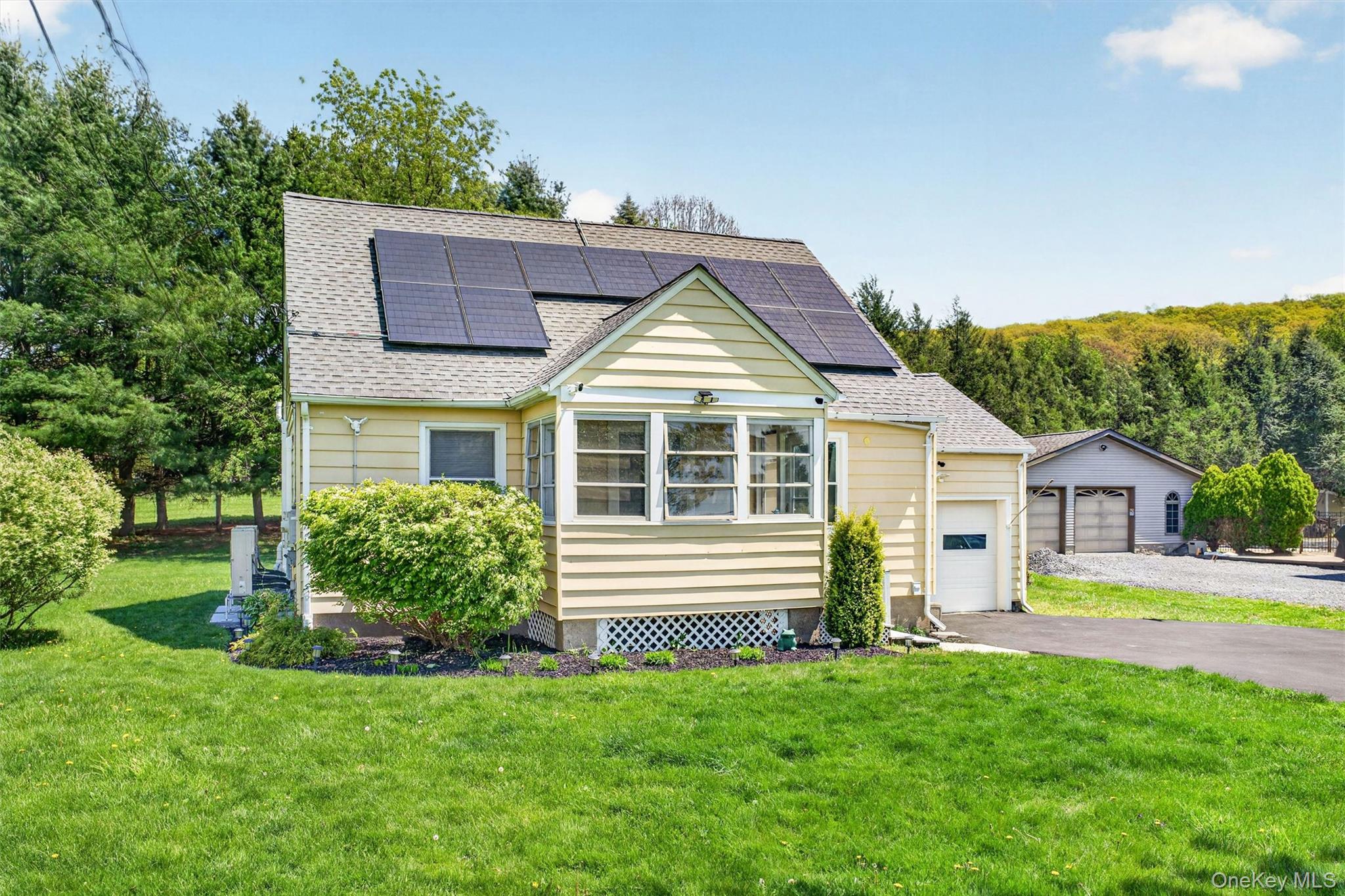 151 Laroe Road Chester, NY 10918 - Photo 3 of 43 a front view of a house with a yard