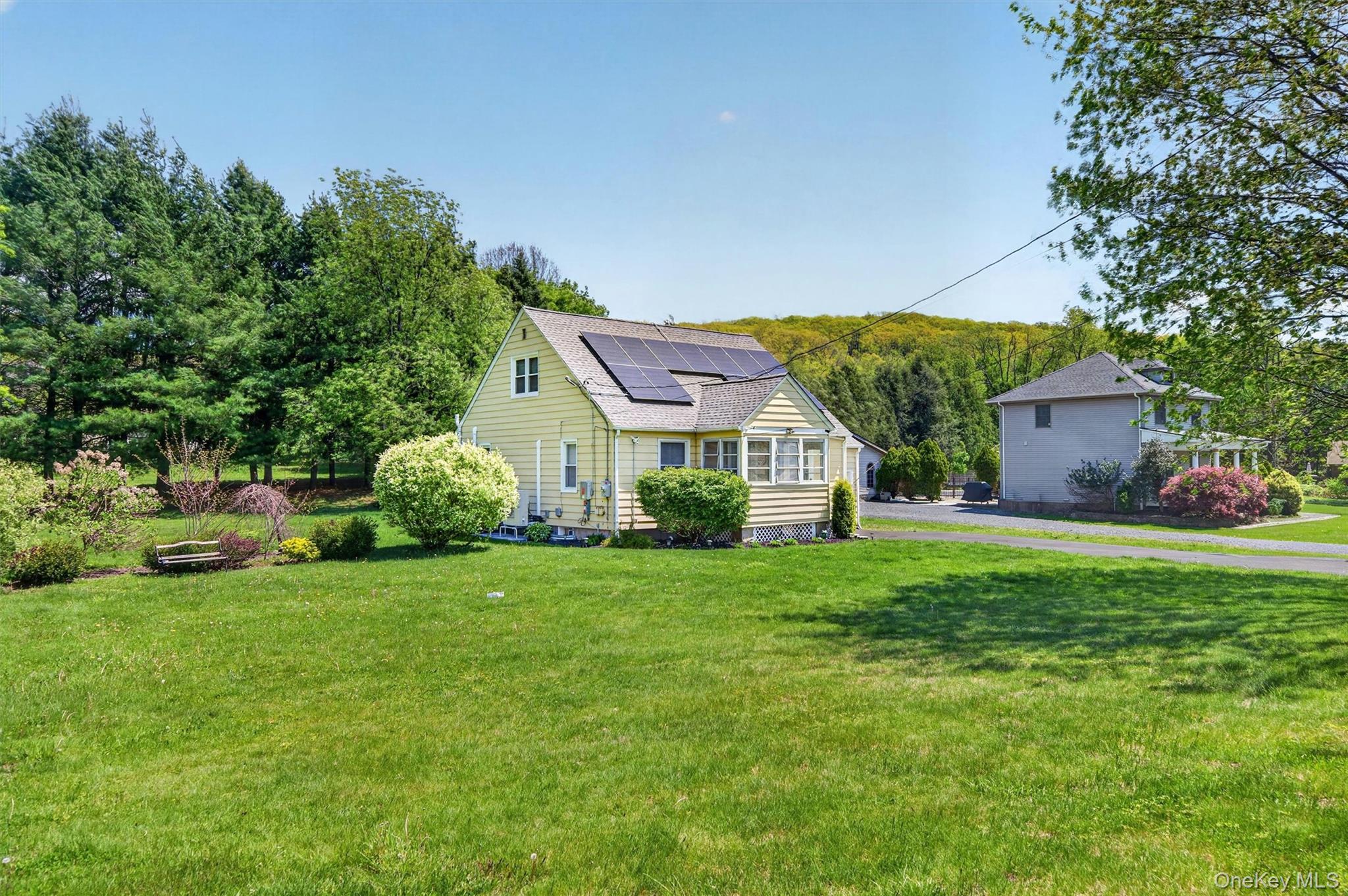 151 Laroe Road Chester, NY 10918 - Photo 4 of 43 a view of a house with a big yard potted plants and a large tree