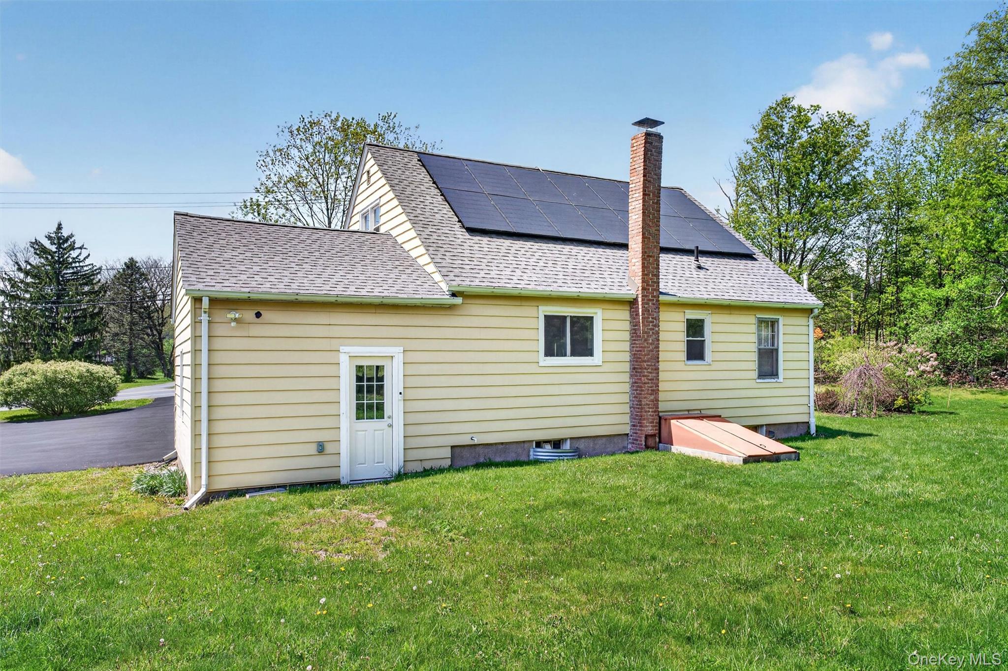 151 Laroe Road Chester, NY 10918 - Photo 43 of 43 a front view of a house with a garden