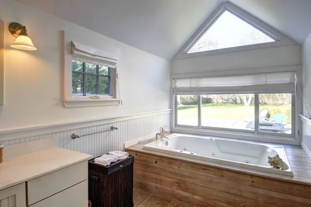 a view of a sink and a window