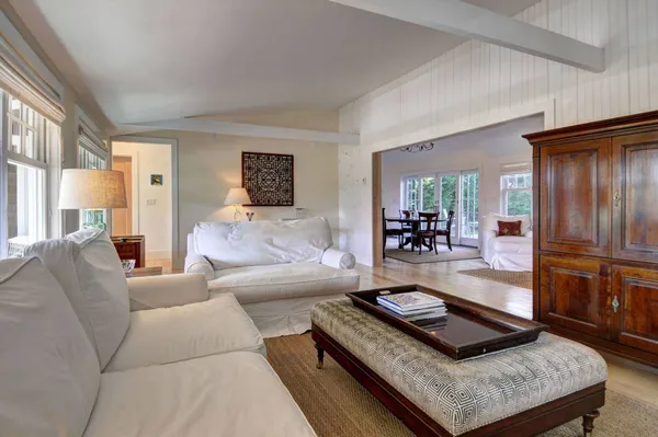 a living room with furniture and a table