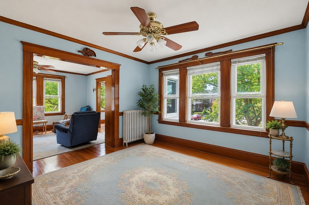 157 Elm Street Somerville, MA 02144 - Photo 7 of 19 a living room with furniture and a large window