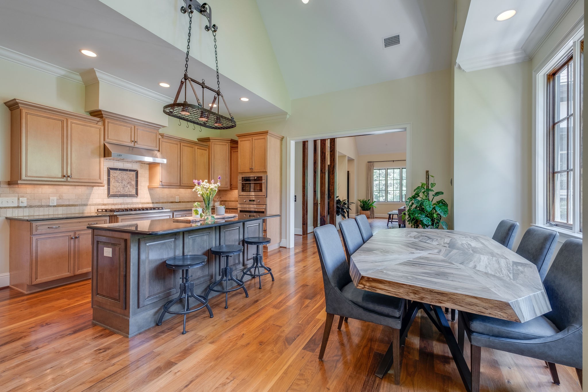 22 Compton Trace Nashville, TN 37215 - Photo 12 of 28 a kitchen with a dining table chairs stainless steel appliances and cabinets
