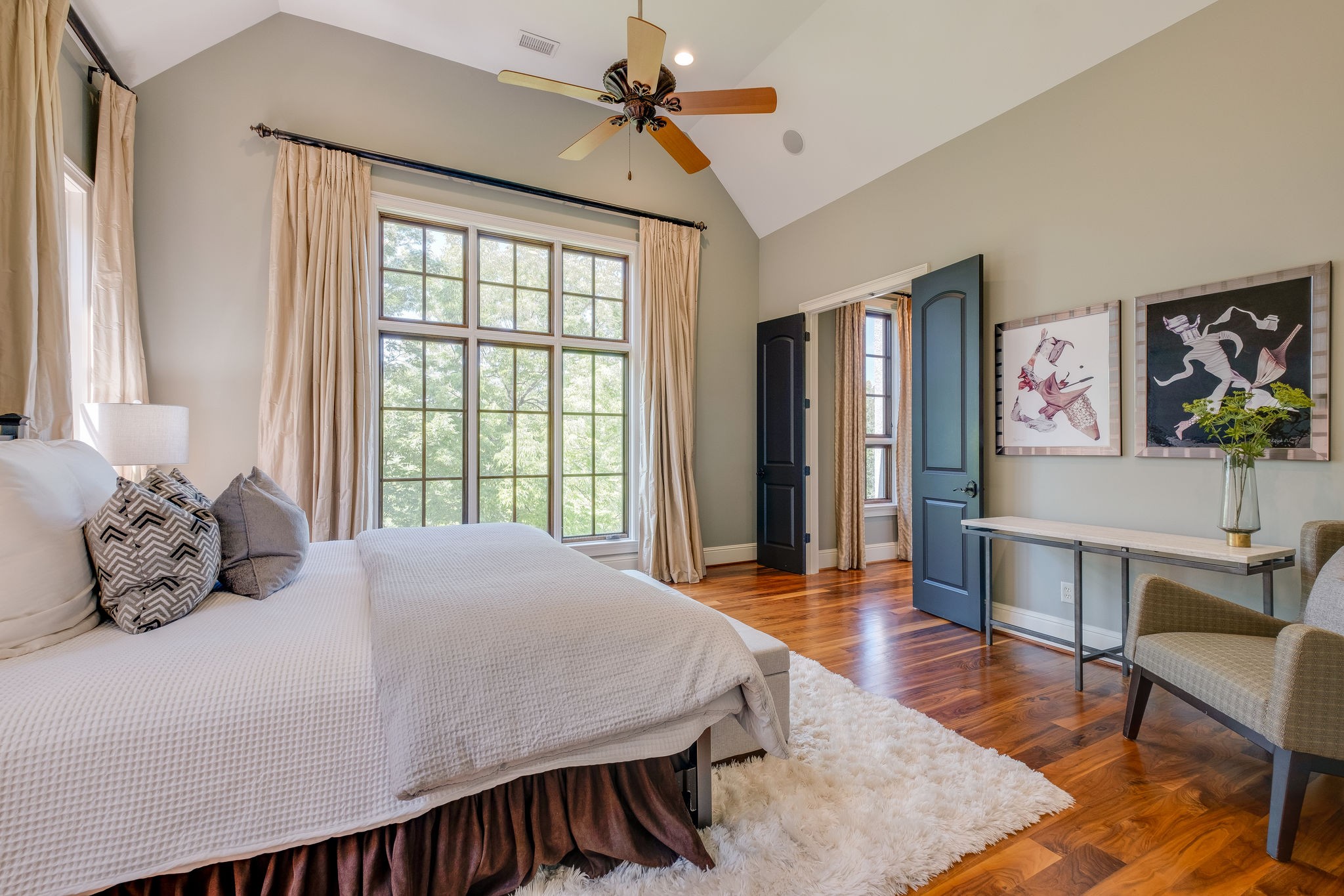 22 Compton Trace Nashville, TN 37215 - Photo 17 of 28 a bedroom with a large bed a chandelier and a window