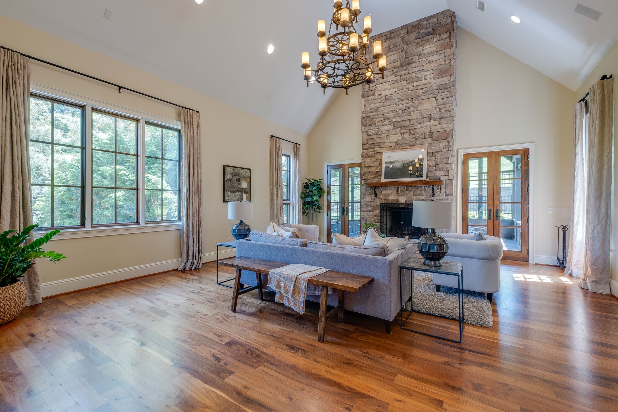 22 Compton Trace Nashville, TN 37215 - Photo 7 of 28 a living room with furniture a fireplace and a chandelier