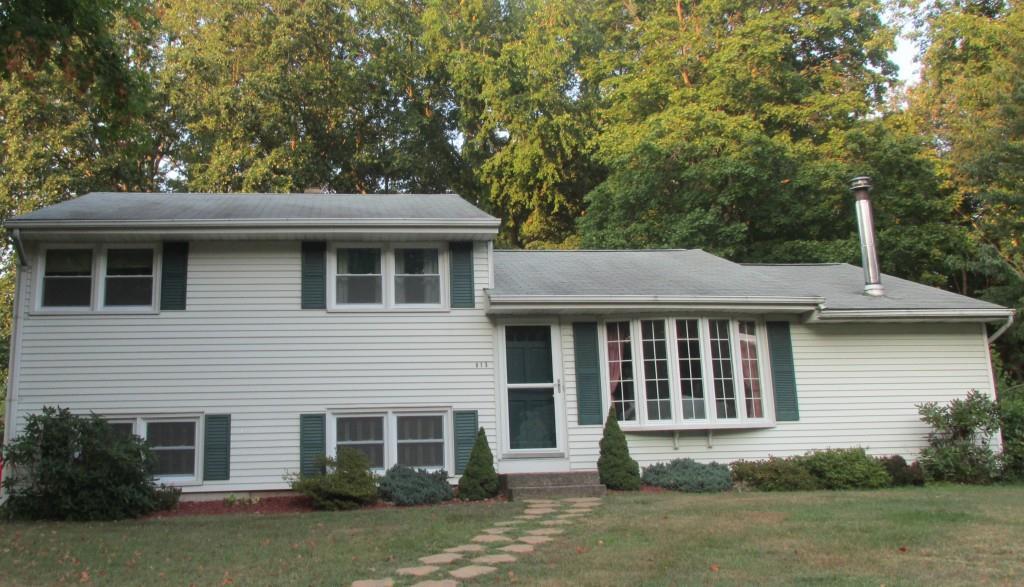 613 6th Ridge Road Wallingford, CT 06492 - Photo 1 of 1 a front view of a house with garden