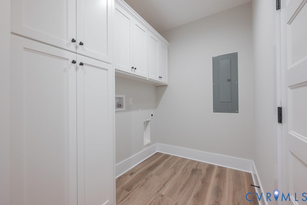 1 Tabscott Road Kents Store, VA 23084 - Photo 36 of 42 Laundry room featuring extensive white cabinetry,