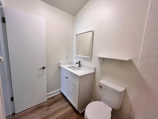 a bathroom with a sink toilet and vanity