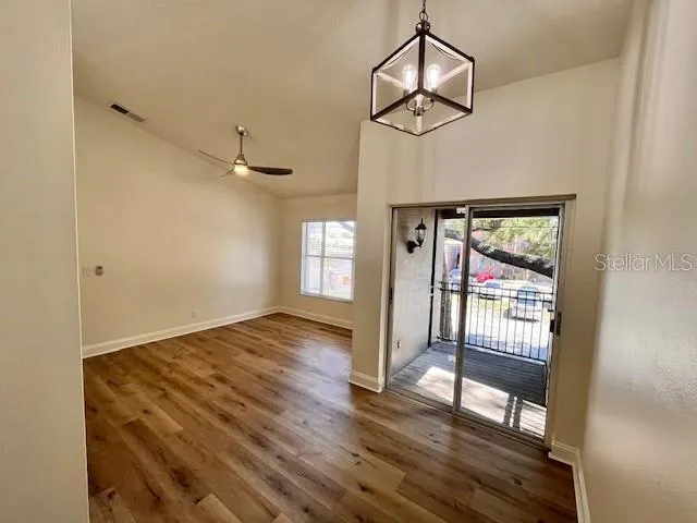 wooden floor in an empty room with a window