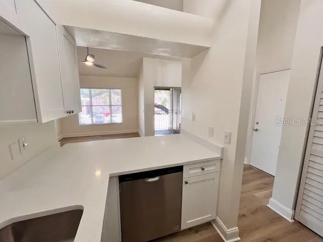 a kitchen with a stove and a refrigerator