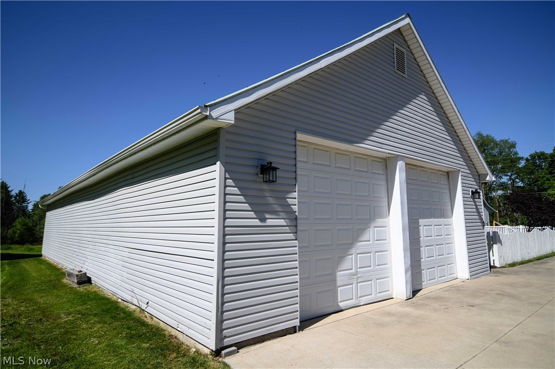 4540 Ridge Road Medina, OH 44256 - Photo 34 of 49 30' x 60' garage provides ample space for cars, workshop, or your equipment needs.