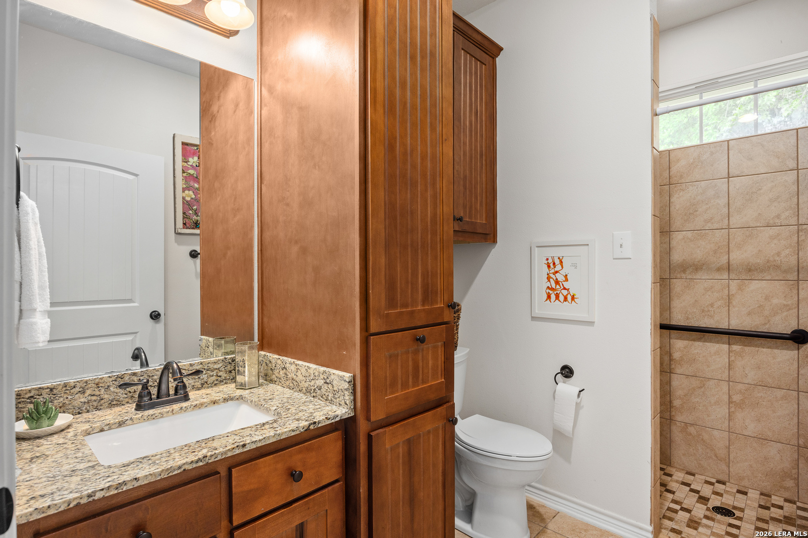 201 Cedar Cliff Loop West Hunt, TX 78024 - Photo 17 of 33 a bathroom with a granite countertop sink toilet and shower