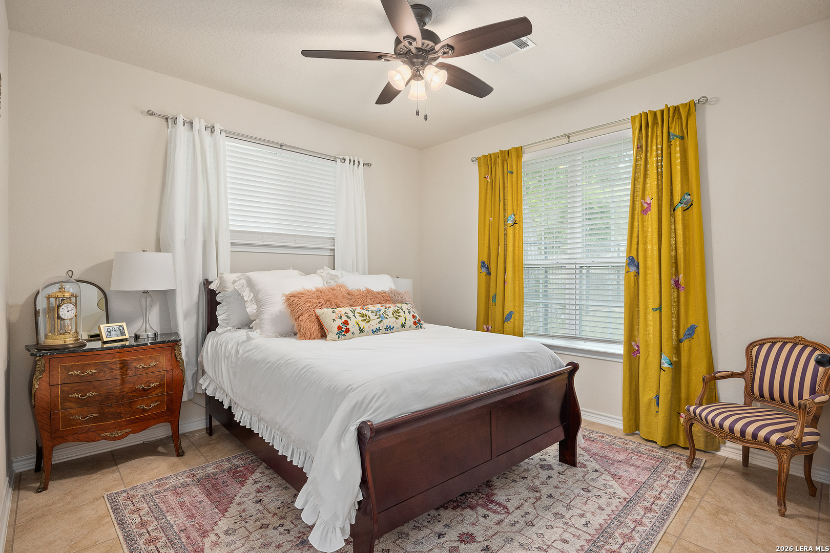 201 Cedar Cliff Loop West Hunt, TX 78024 - Photo 18 of 33 a bedroom with a bed and ceiling fan