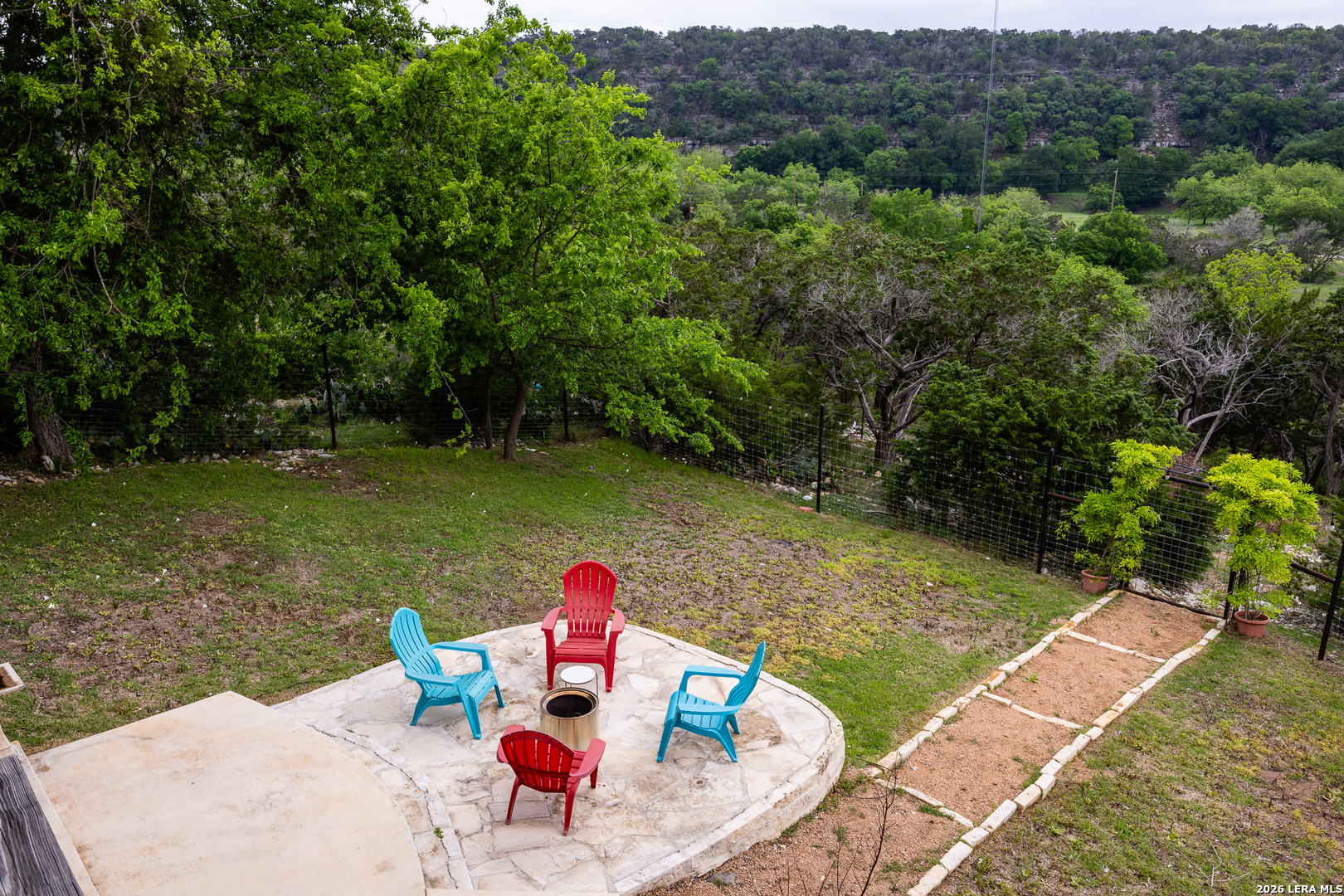 201 Cedar Cliff Loop West Hunt, TX 78024 - Photo 24 of 33 a view of a outdoor dining space with lounge chair