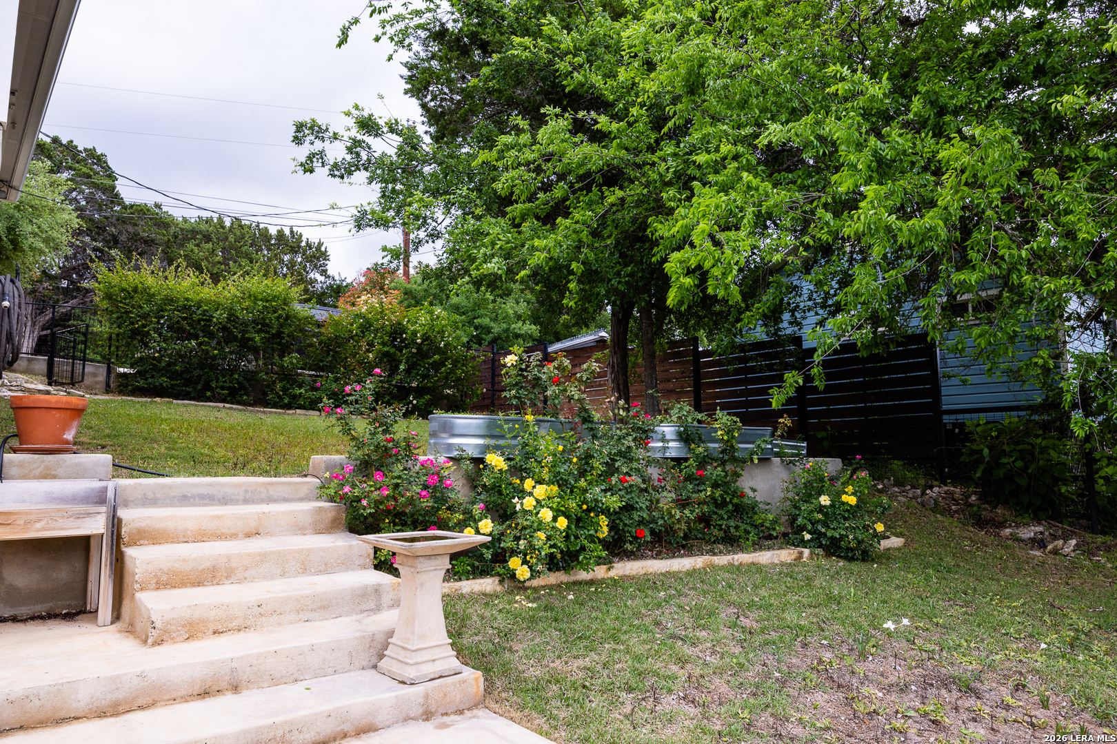 201 Cedar Cliff Loop West Hunt, TX 78024 - Photo 25 of 33 a view of garden with wooden bench